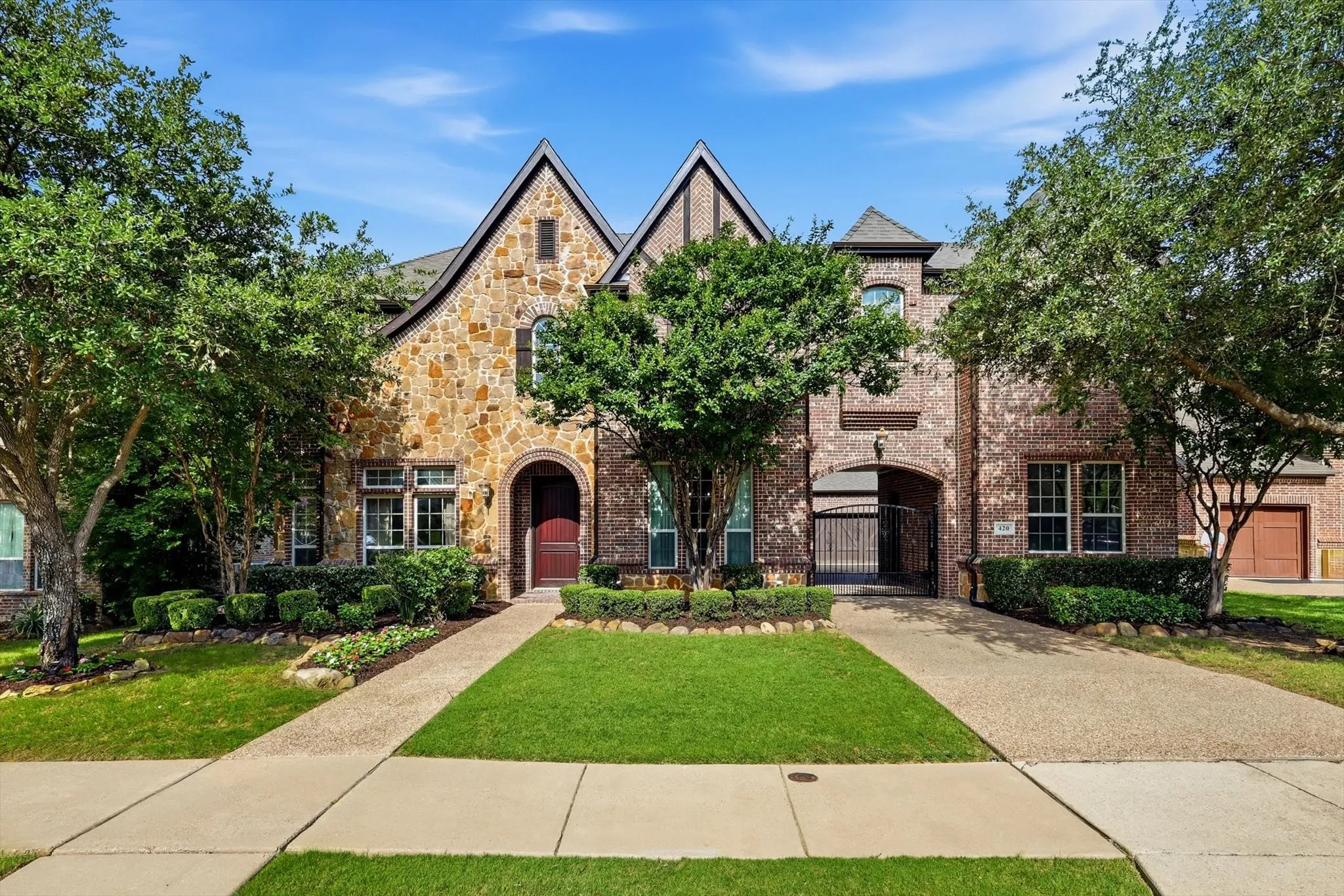 Stone and brick exterior with pitched gable roofs