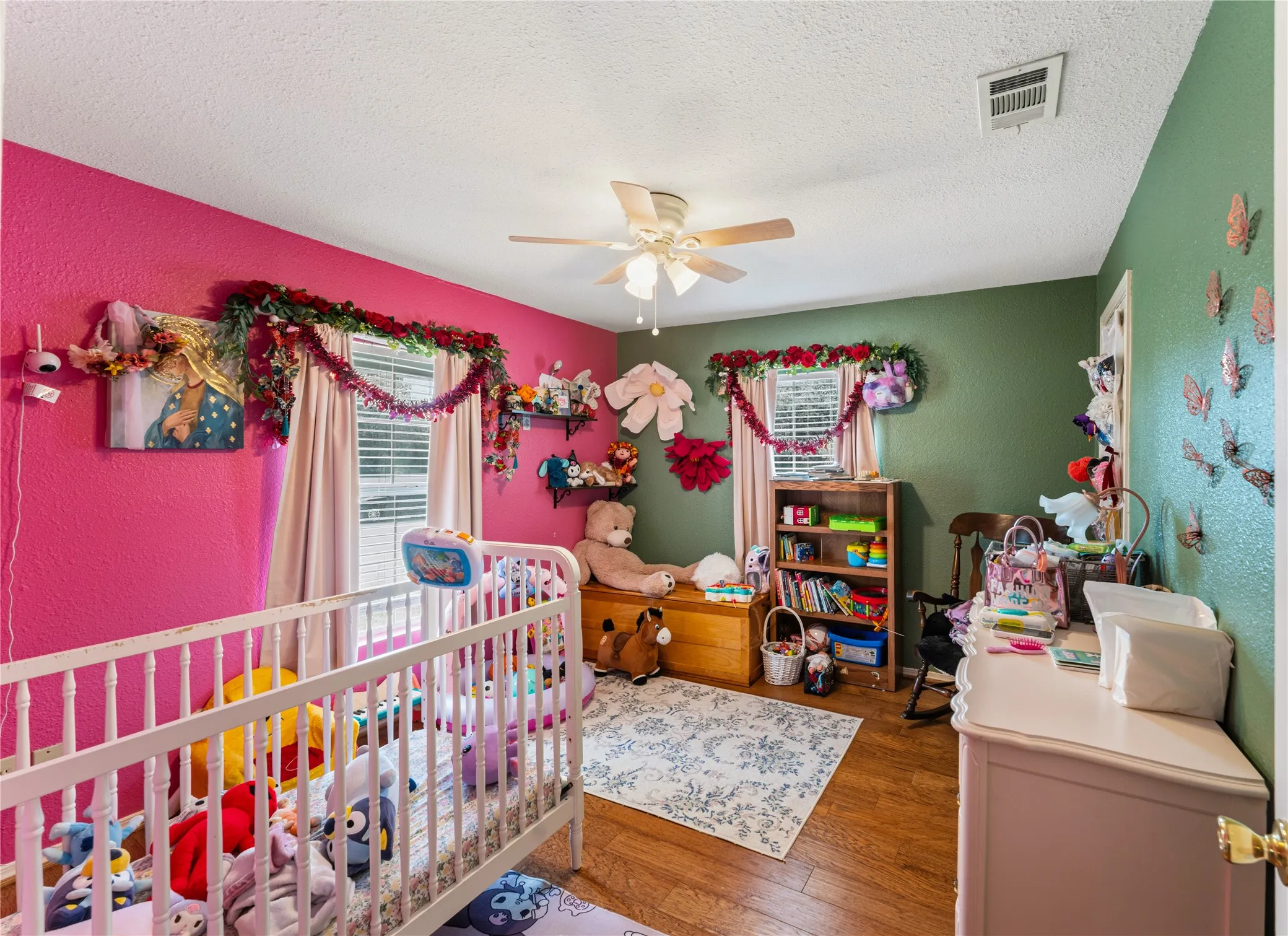 Wood-finish flooring with a ceiling fan light fixture
