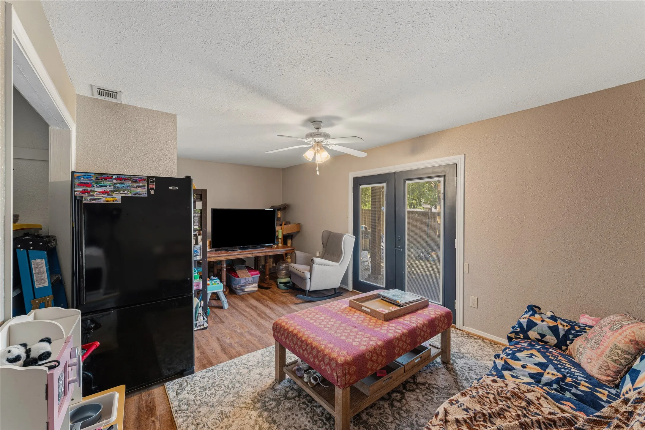 Wood-finish flooring throughout, complemented by light-toned wall finishes