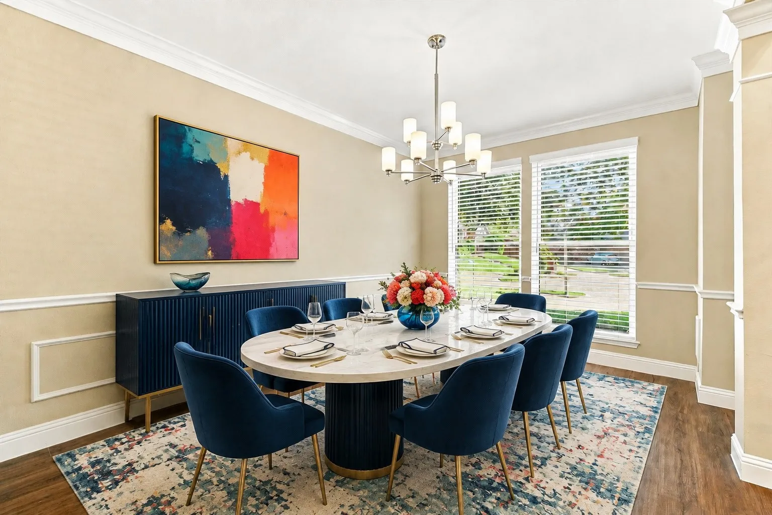 Virtually Staged Formal Dining Room with wood flooring with crown molding and wainscoting details