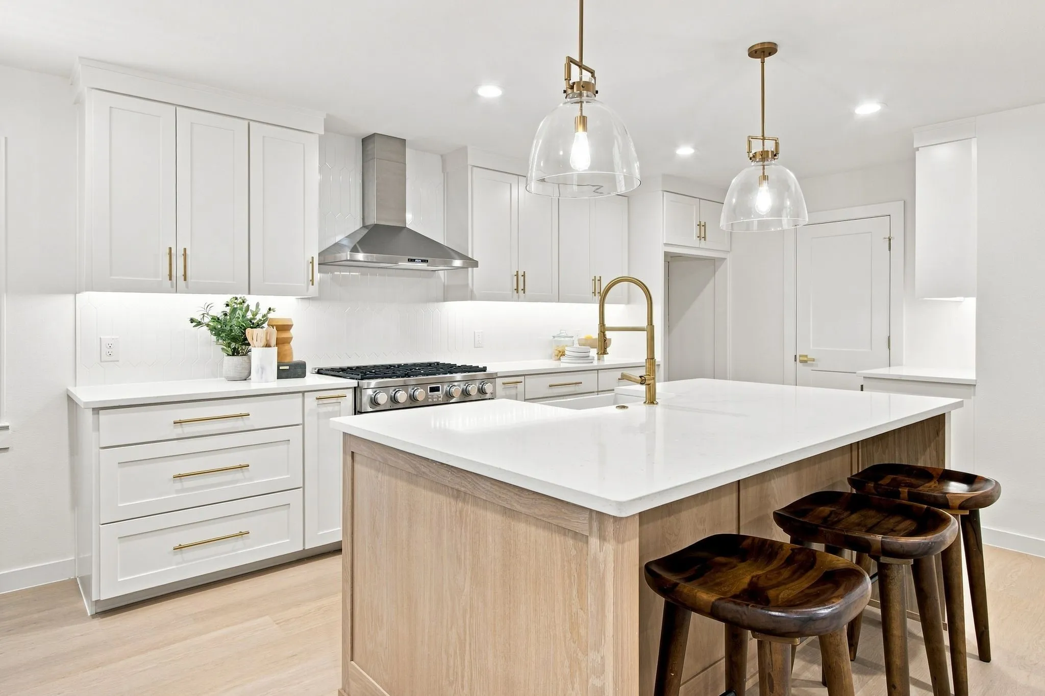 Kitchen featuring all updated cabinetry, a large kitchen island with overlooking living area.