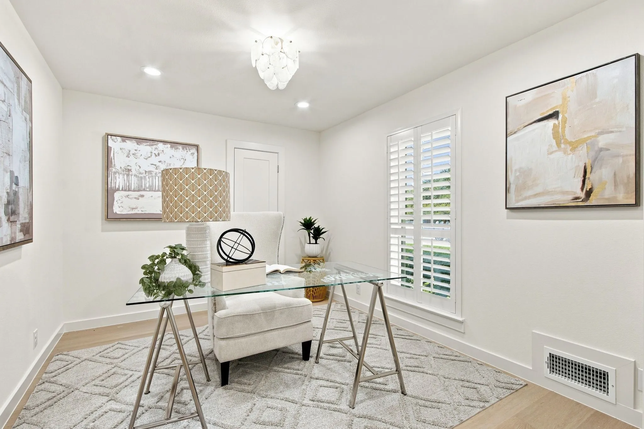 Recessed lighting, beautiful chandelier, closet with electrical for printer and plantation shutters!