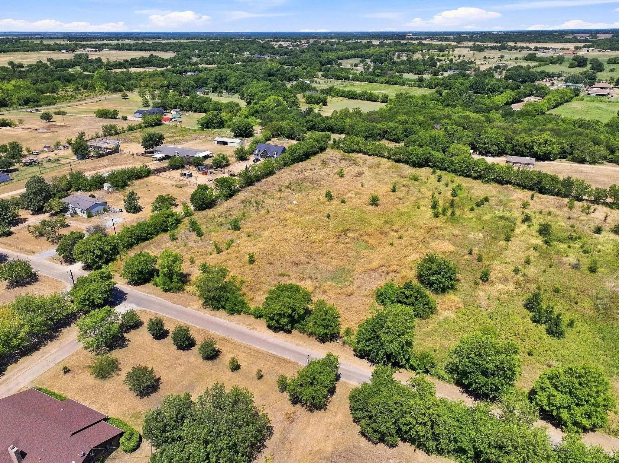 Expansive parcel of land with varied topography and mature trees