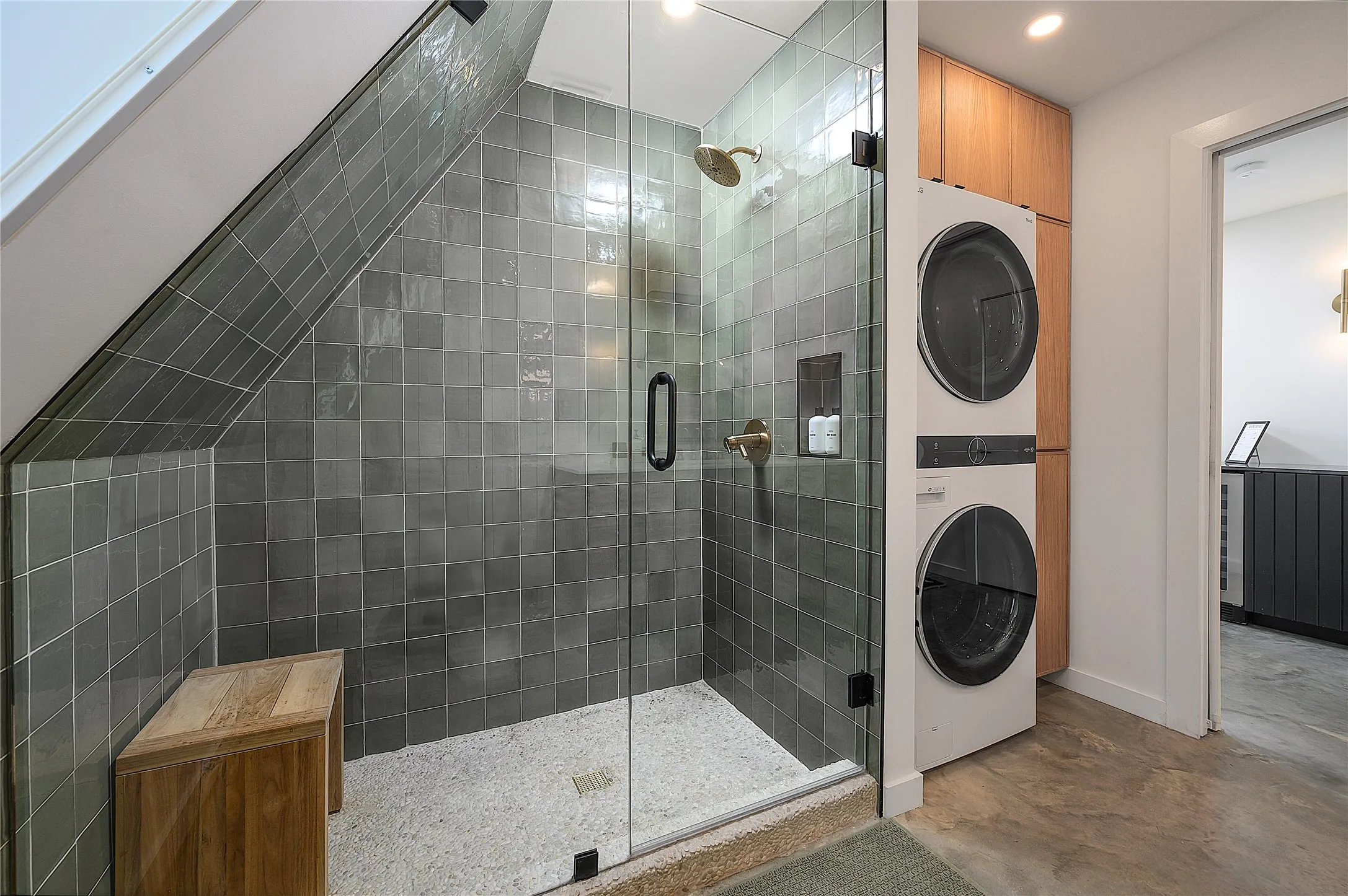 Main floor bathroom walk-in show, stackable washer and dryer