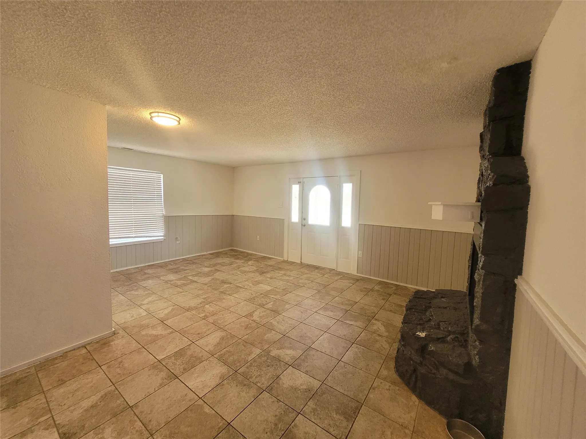 Open family area with other side of fireplace. Breakfast area and living space all in one.