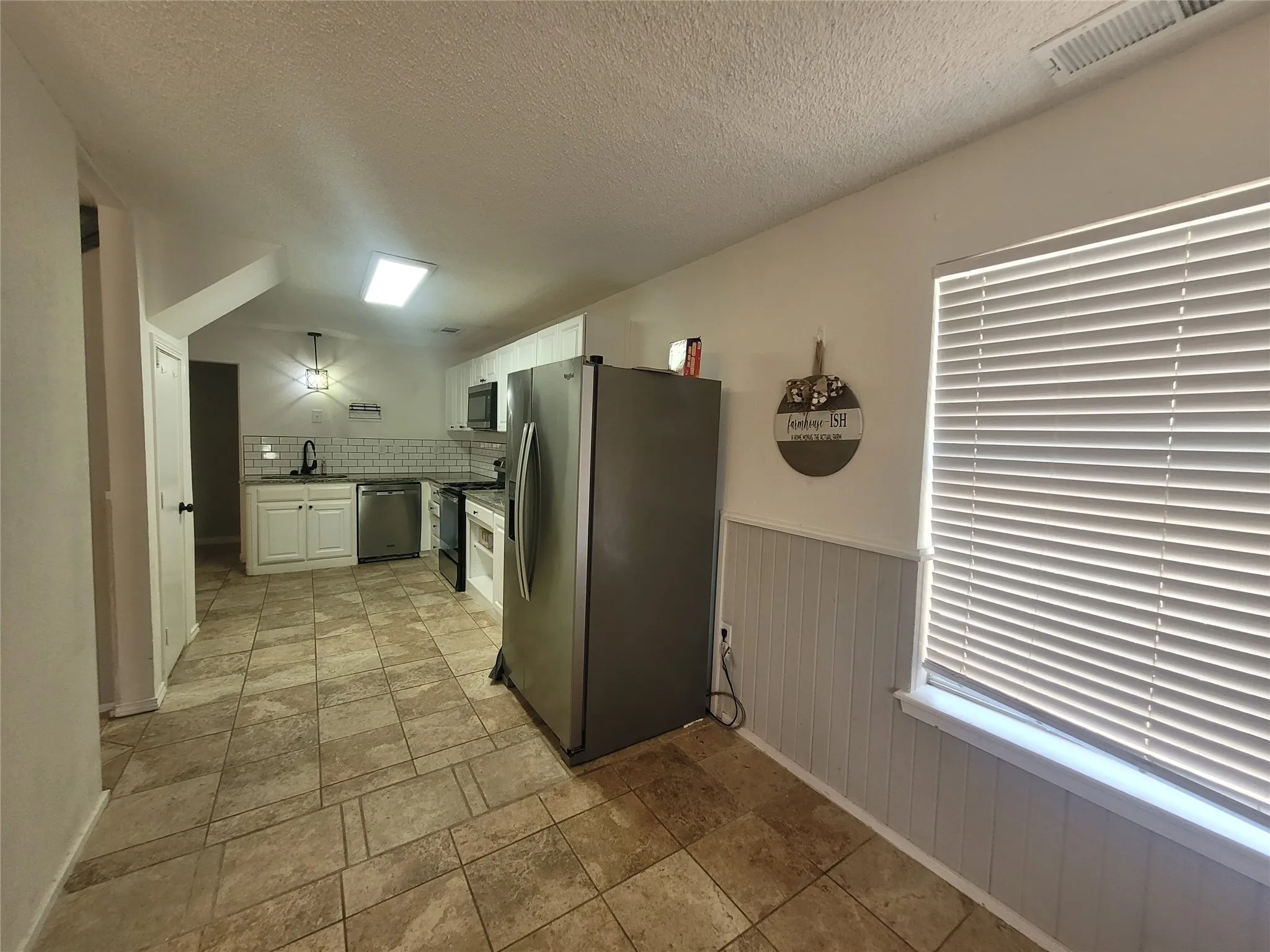 Room for a large breakfast table between the kitchen and family living area.