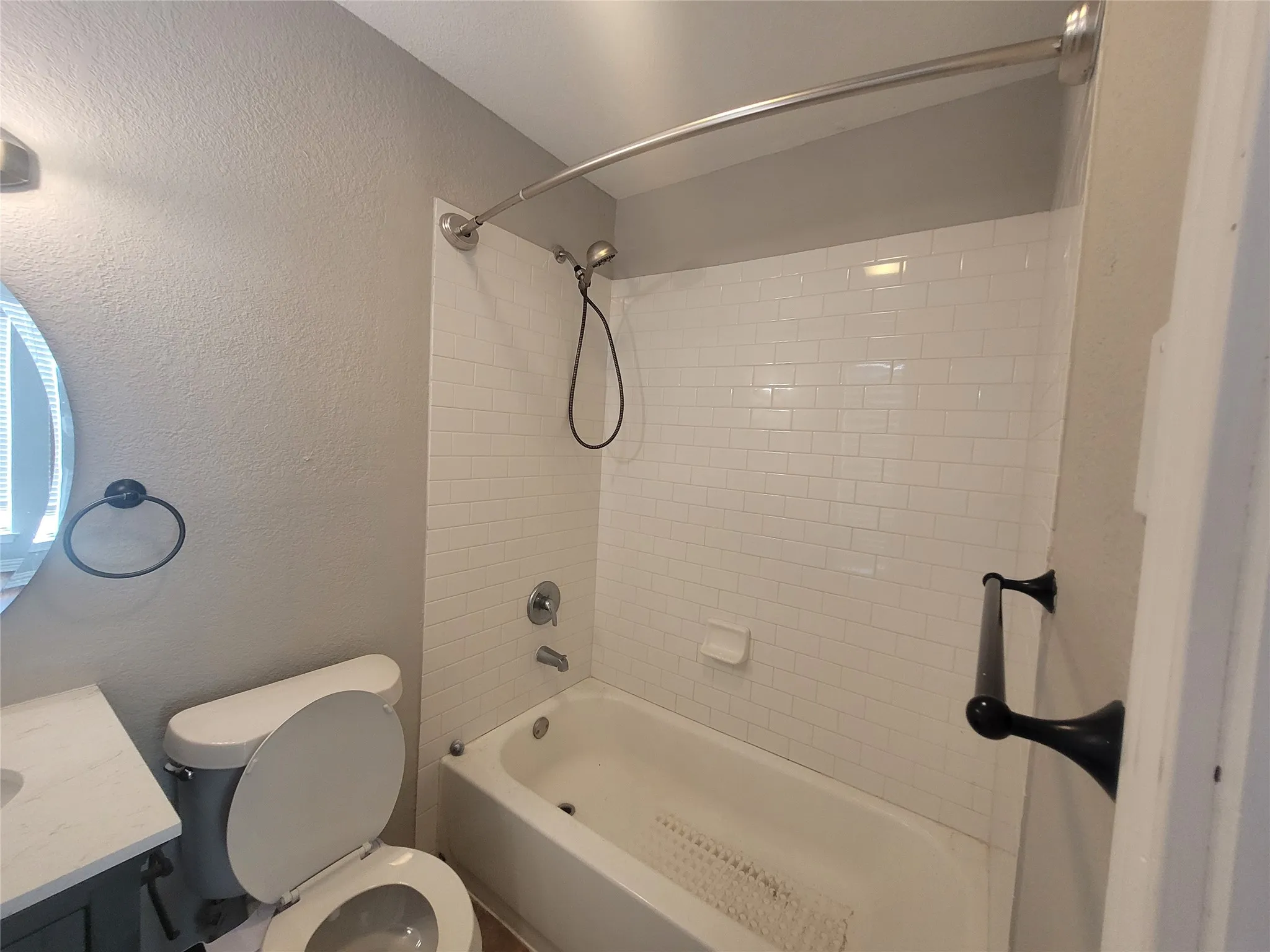 Tub and shower combination in primary bath.