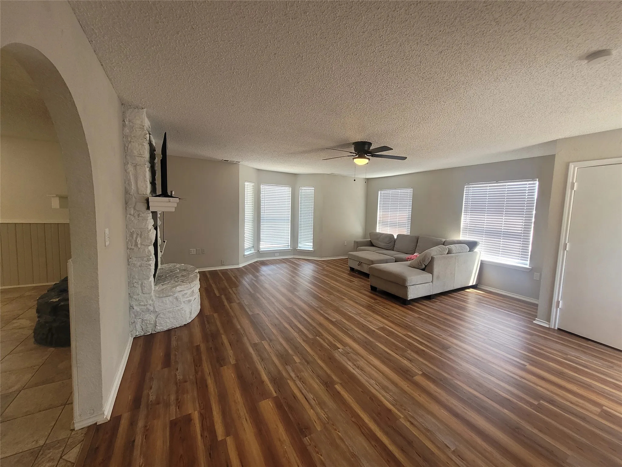 Large living room with double sided fireplace.