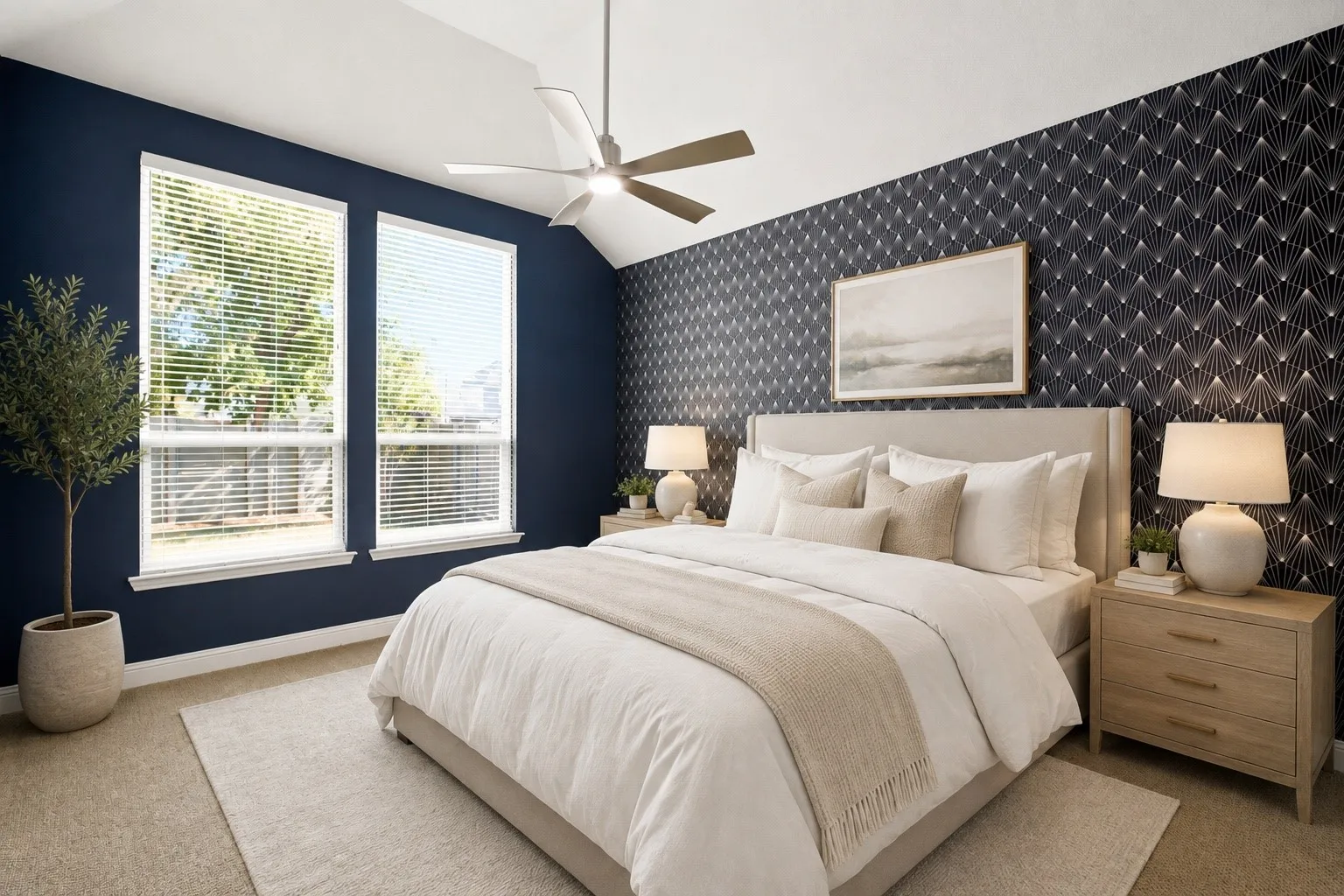 Stunning designer wallpaper accent wall adds a touch of sophistication to the primary bedroom.