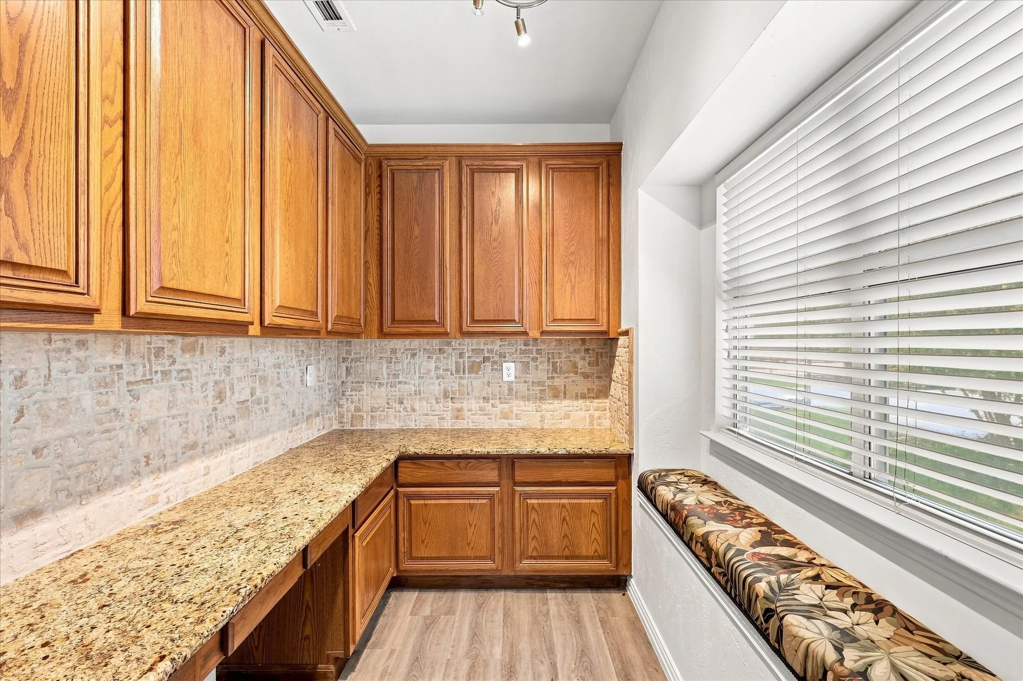 Separate desk area off the kitchen is great for school work or crafting