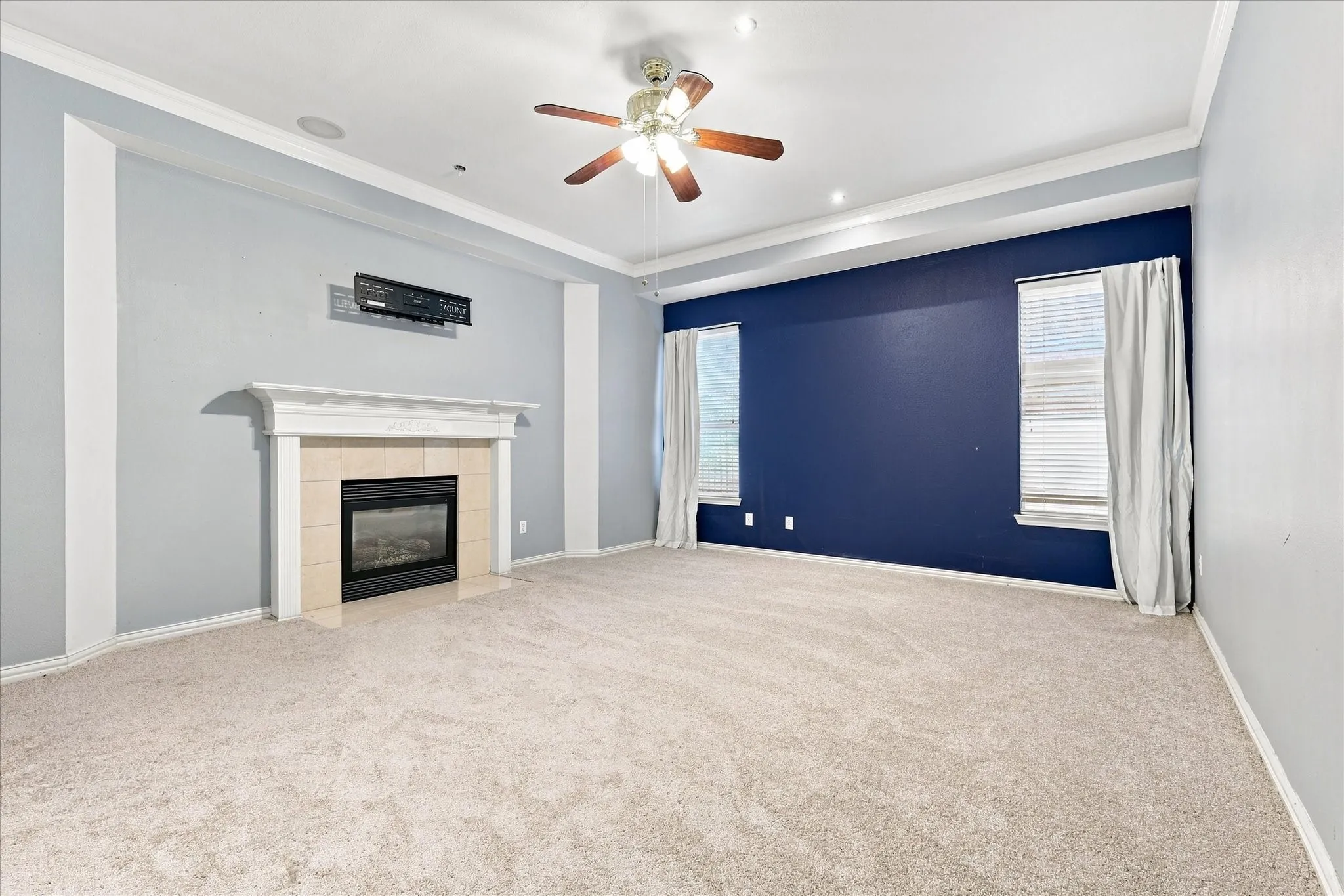 Primary bedroom has a gas fireplace and is wired for surround sound