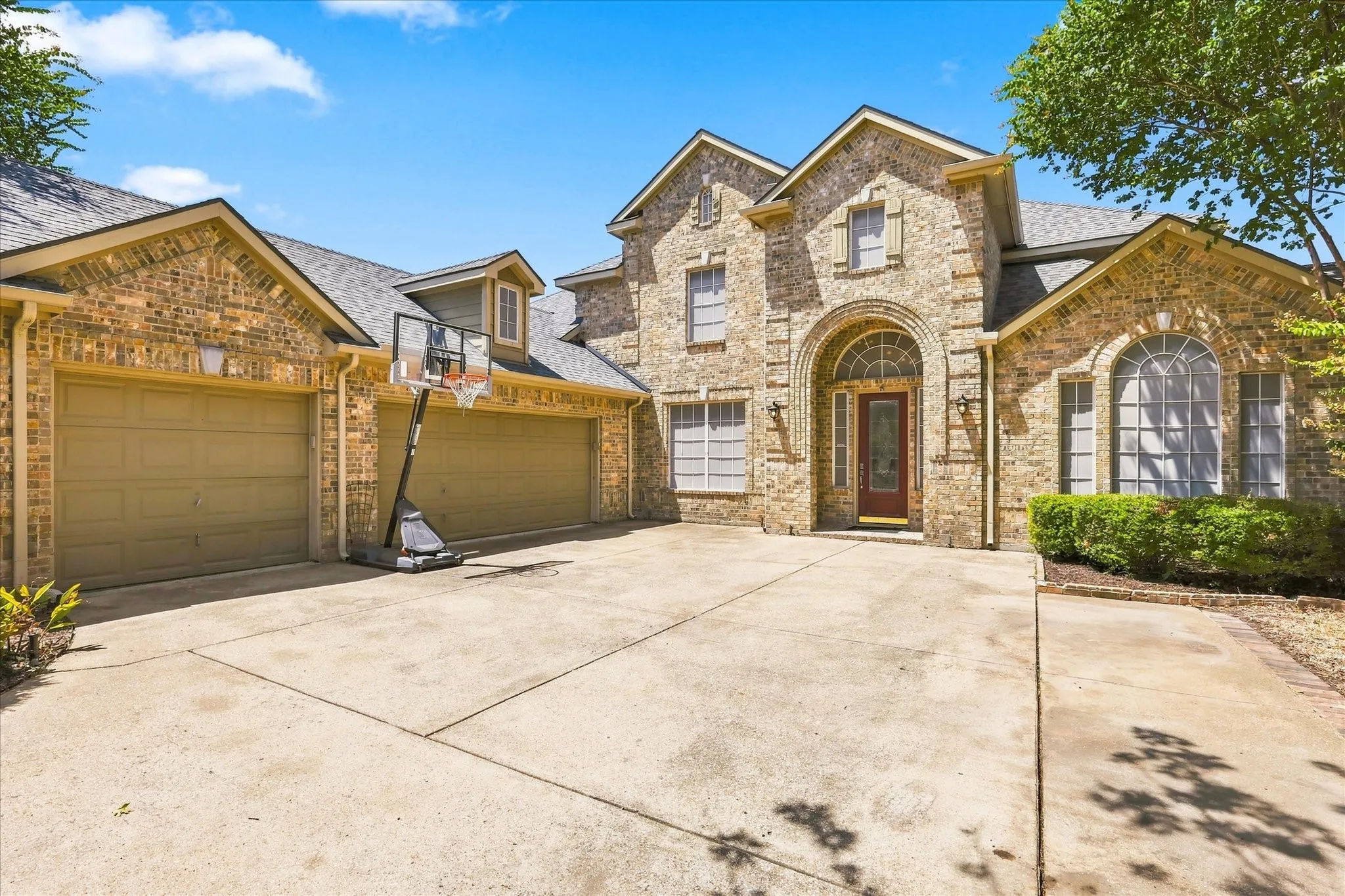 3 car garage with extended driveway is perfect for basketball practice and play time