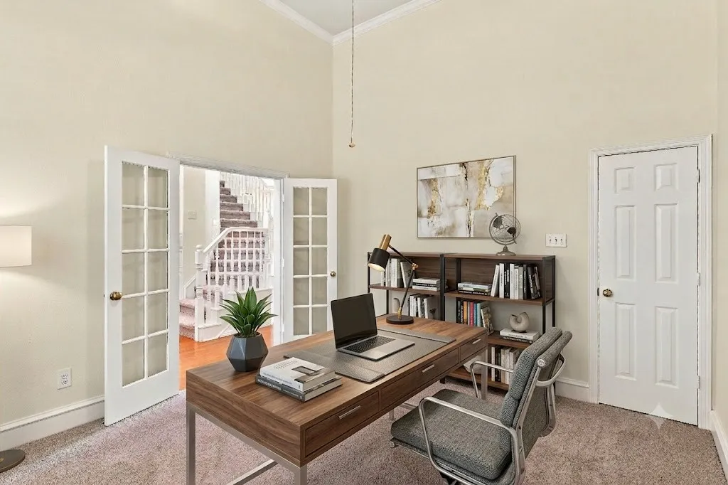 AI - Virtually Staged - Spacious 4th bedroom or office, featuring vaulted ceilings, neutral-toned carpeting, french doors and a six-panel interior closet door or use for office storage.