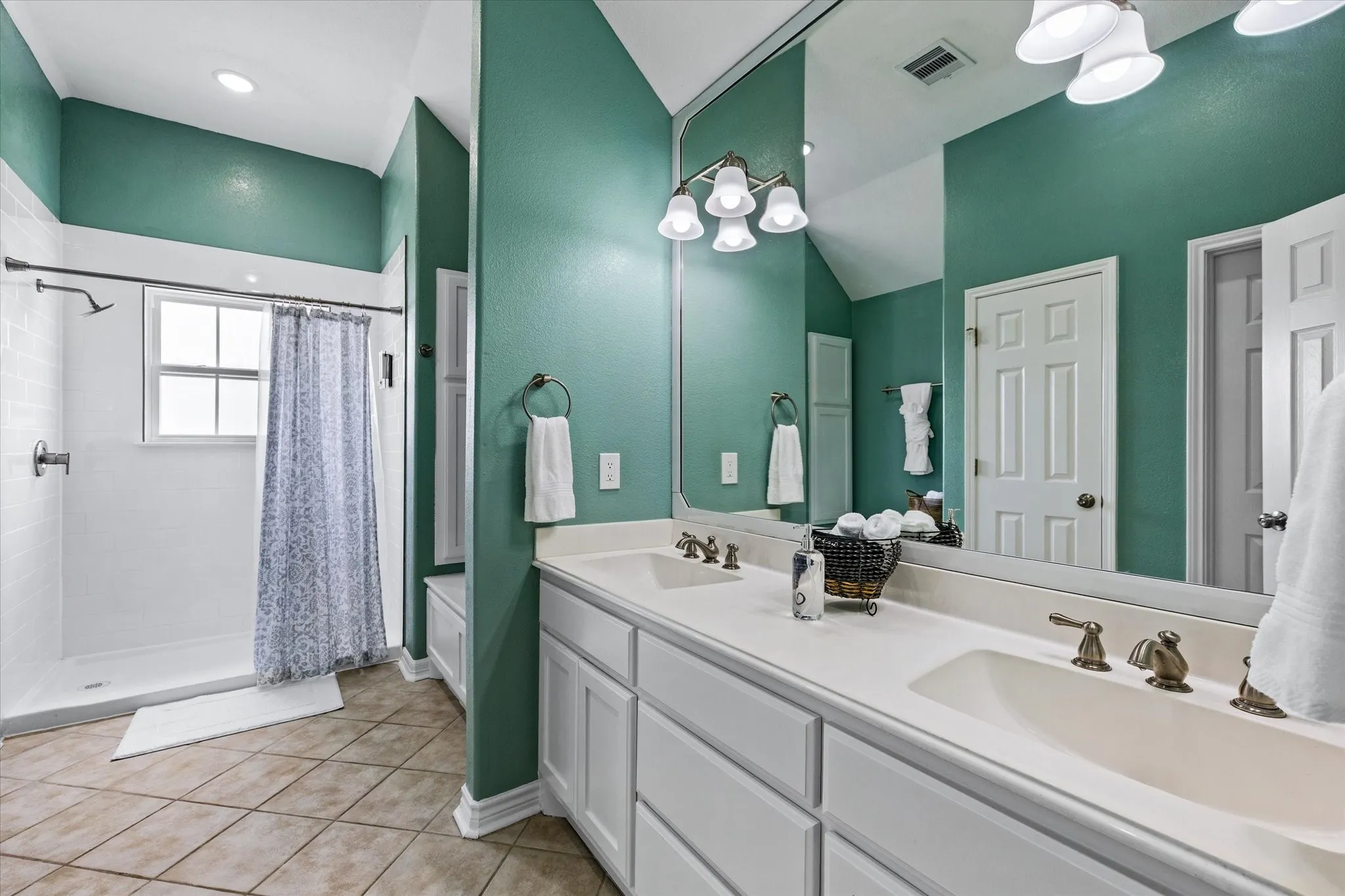 Large primary bathroom with dual sinks and lots of room!