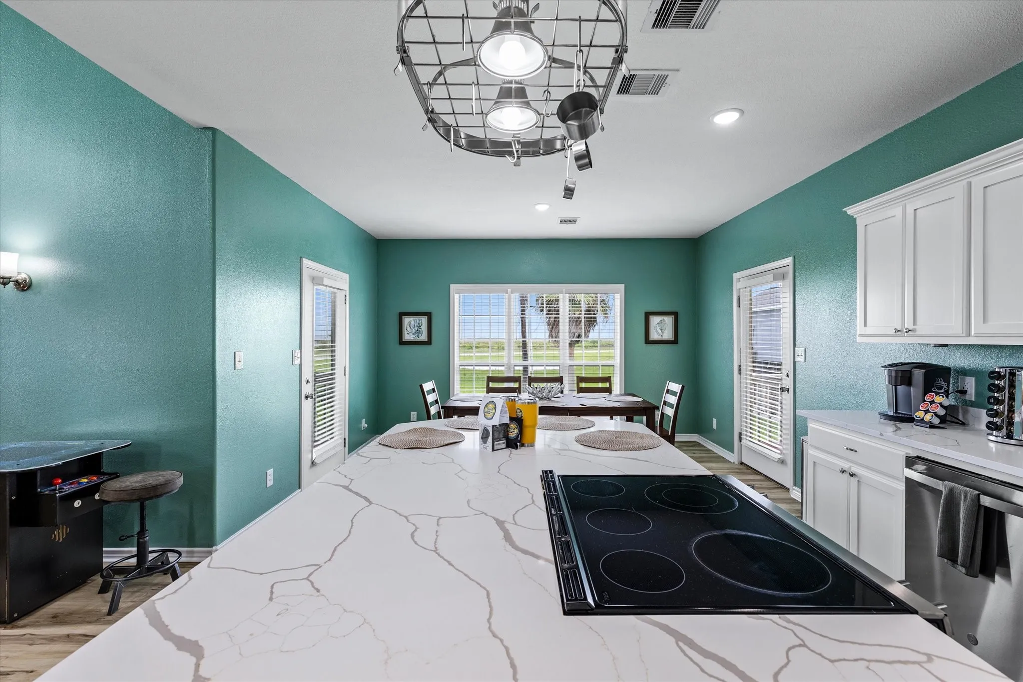 Plenty of seating at 8 person table and 4 barstools + screened in porch!