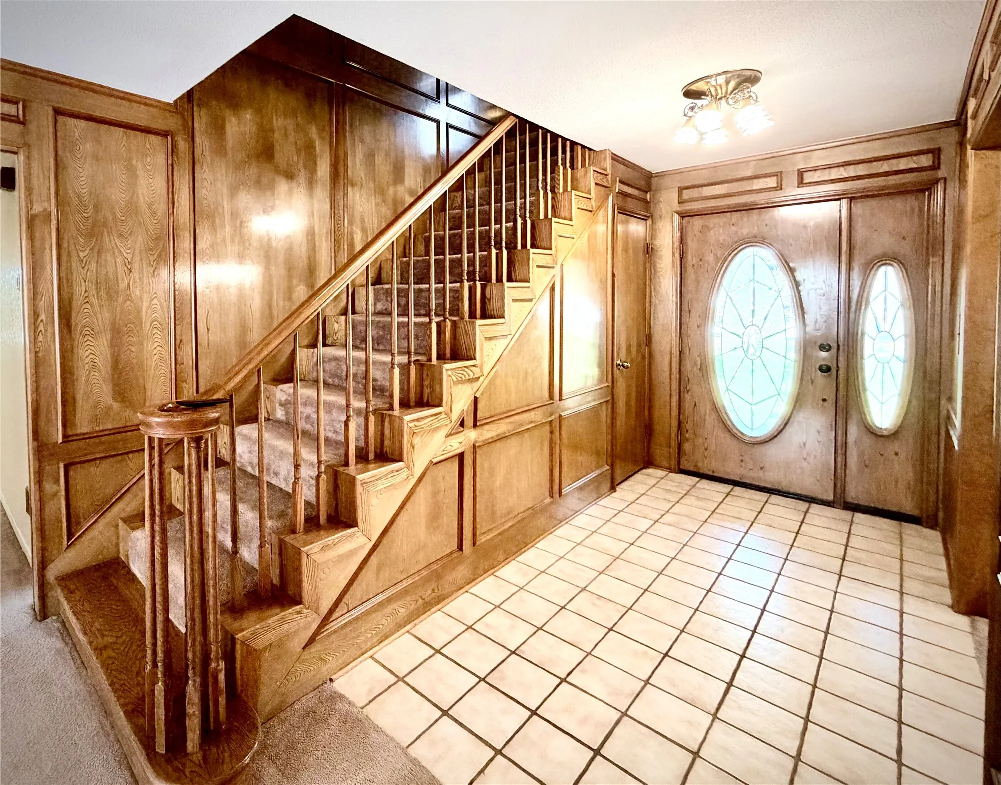 Entry featuring beautiful woodwork