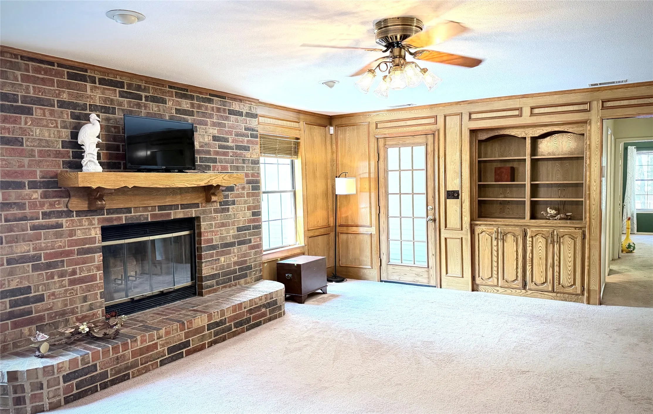 Living room to back door-access to garage and patio