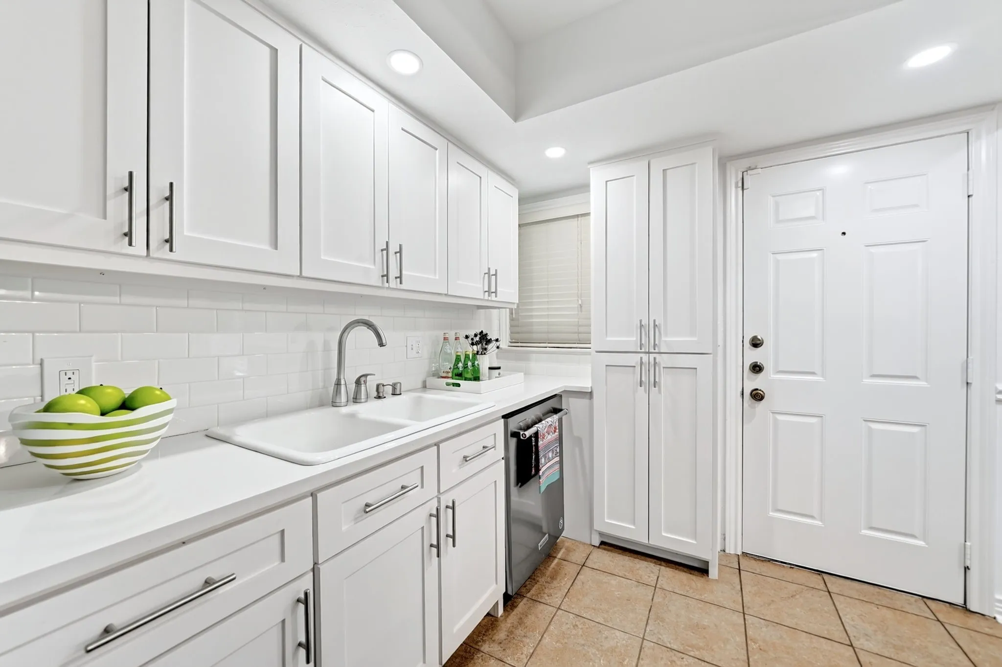 Cabinetry was added next to the door for additional storage.