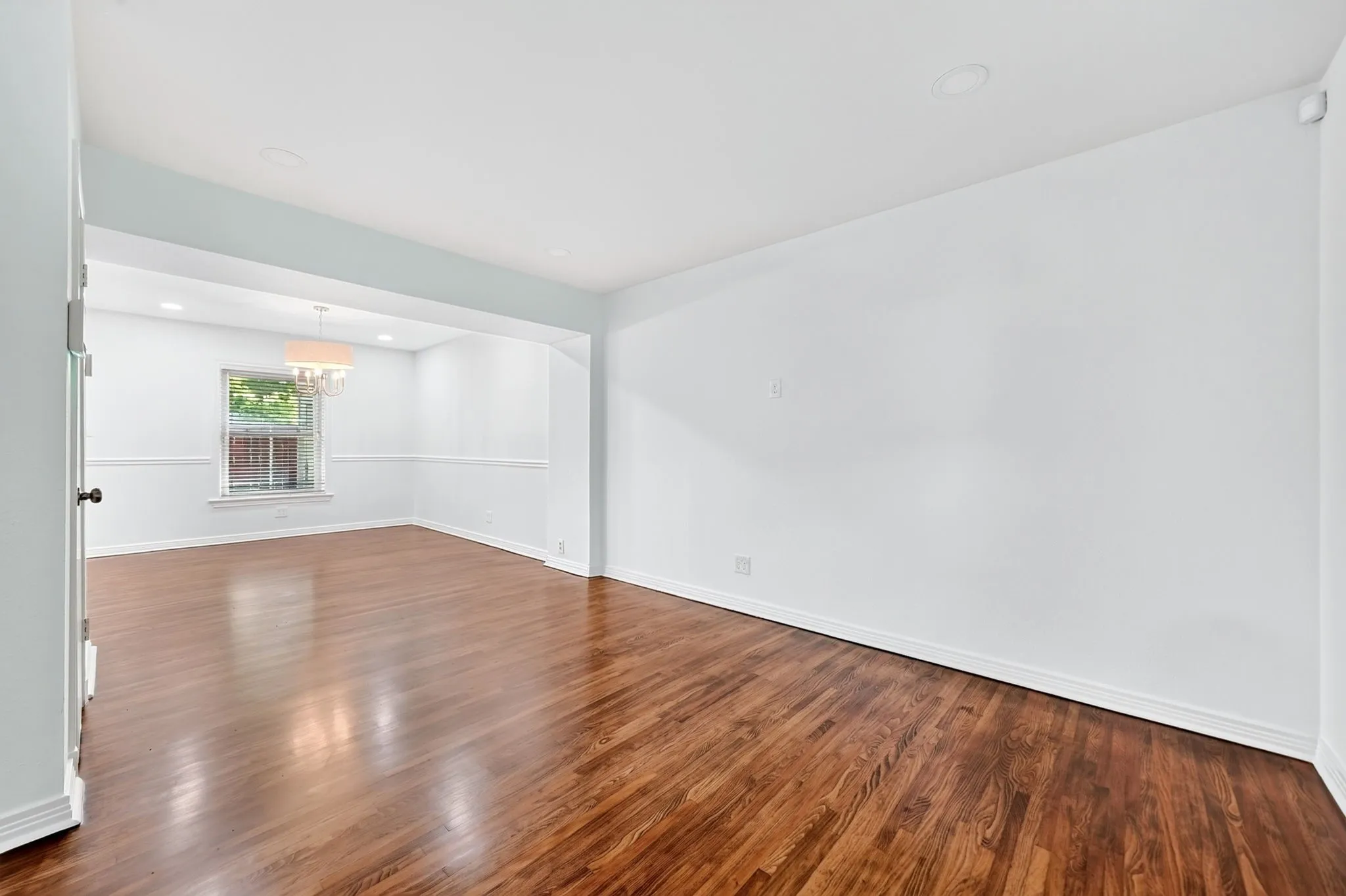 Recently refinished hardwood floors gleam in the living room.