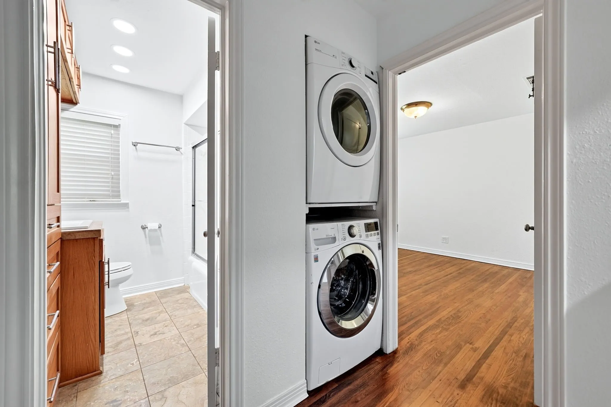 Stacked full-size washer and dryer convey with the property.