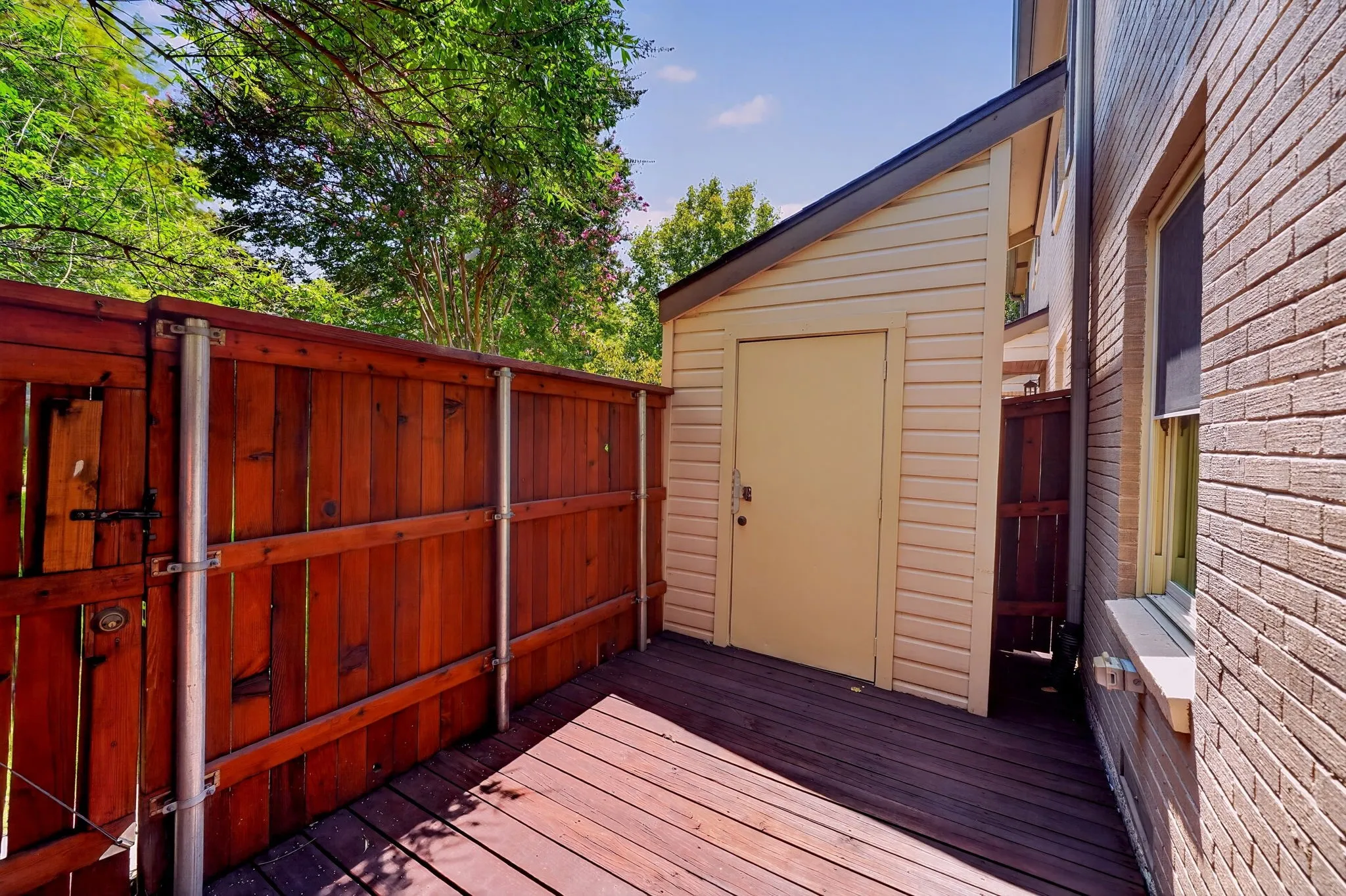 The enclosed private deck and storage building.