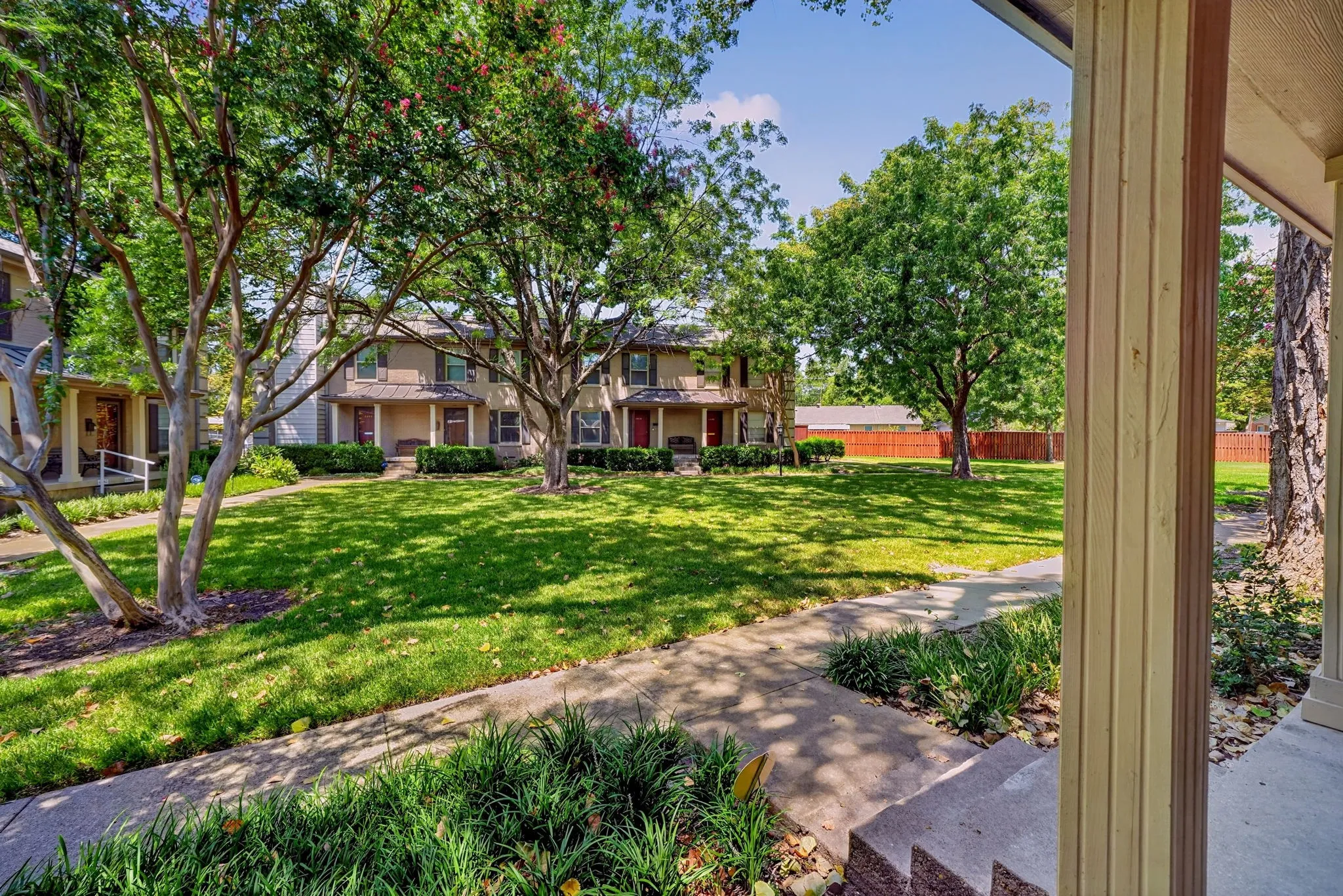 The view of the lush lawn of the greenbelt from the front porch.