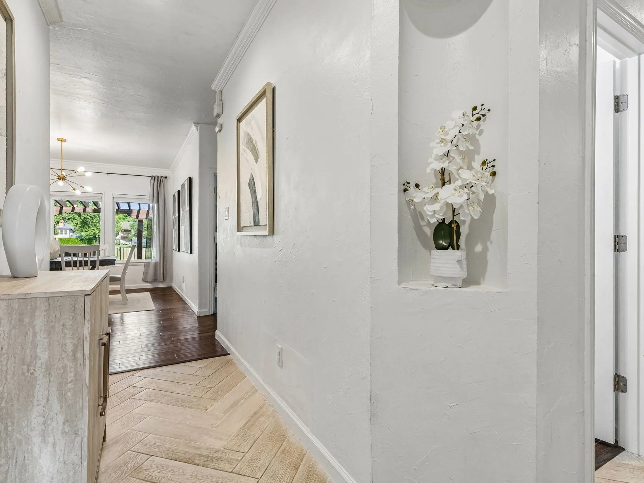 Herringbone tiled entry adds the luxury tone