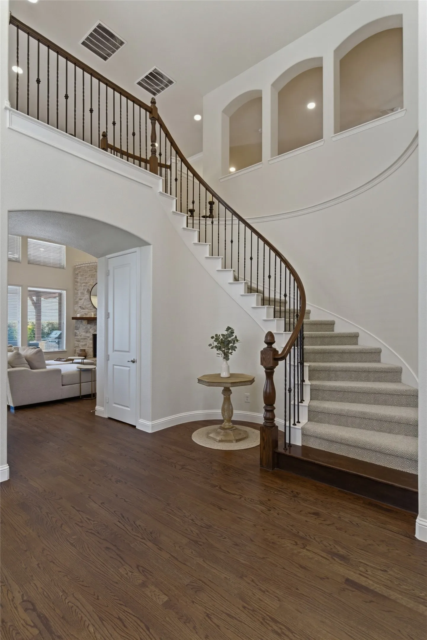 
Stunning entry with curved staircase and hardwood floors.