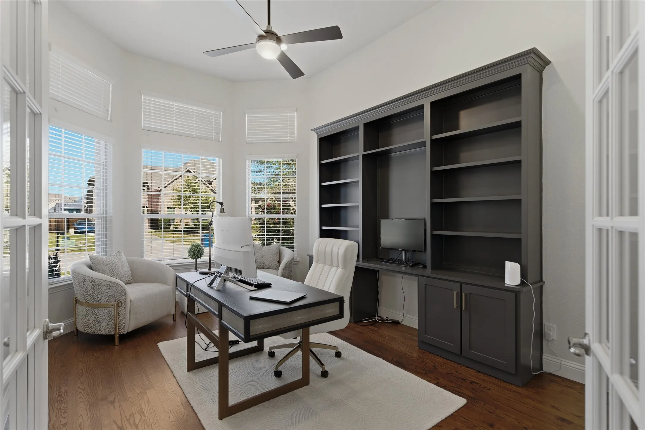 Large office with built in cabinets, perfect for work at home