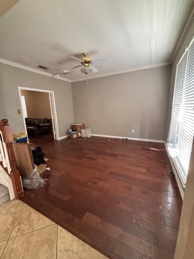 1 of 3 living rooms. Could be a home office or play room.