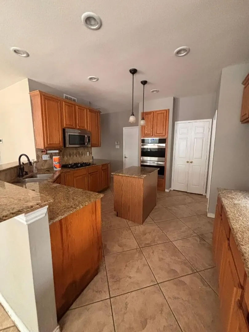 Granite counters, breakfast bar and island.