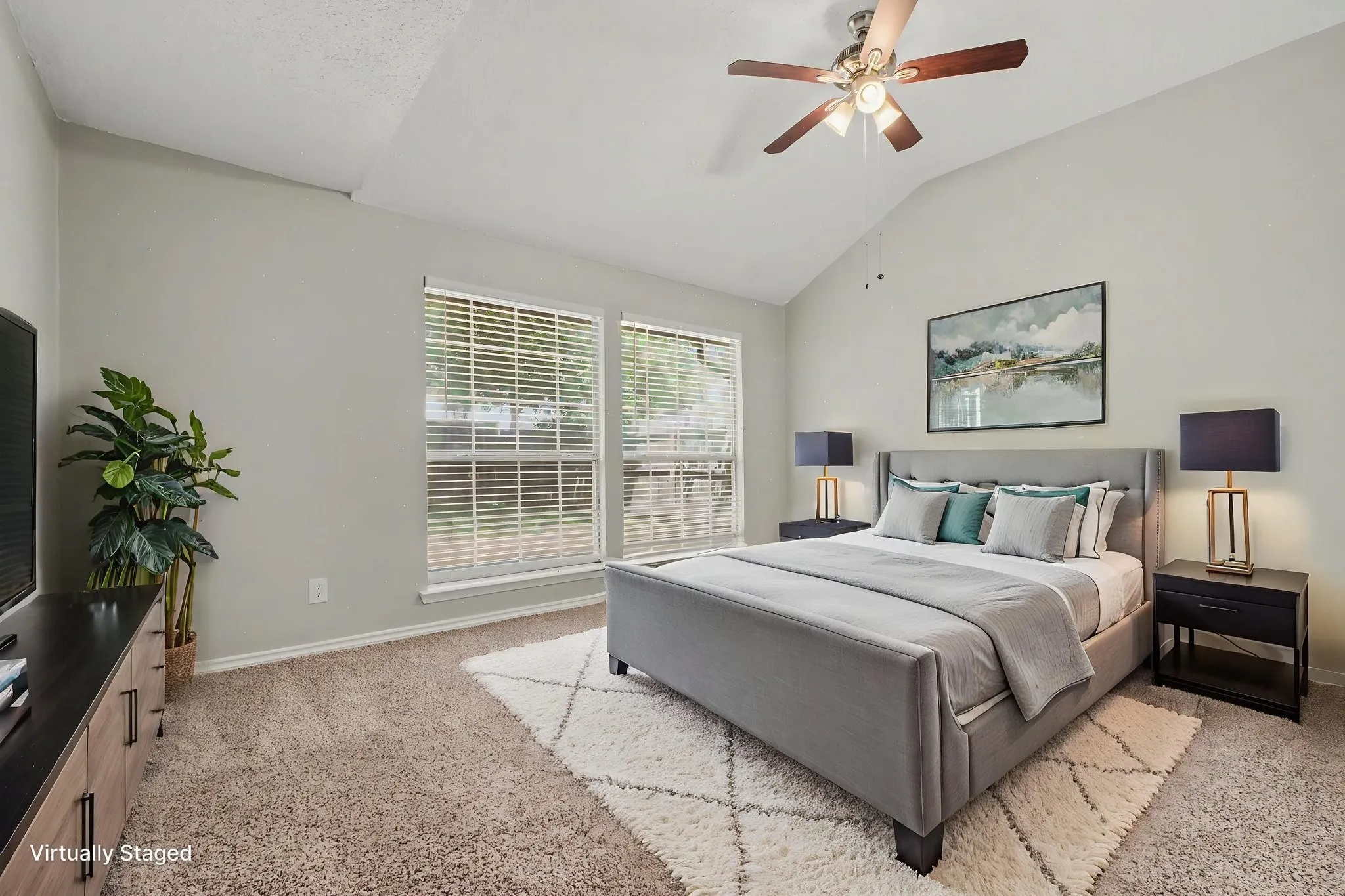 Virtually staged primary bedroom main floor.