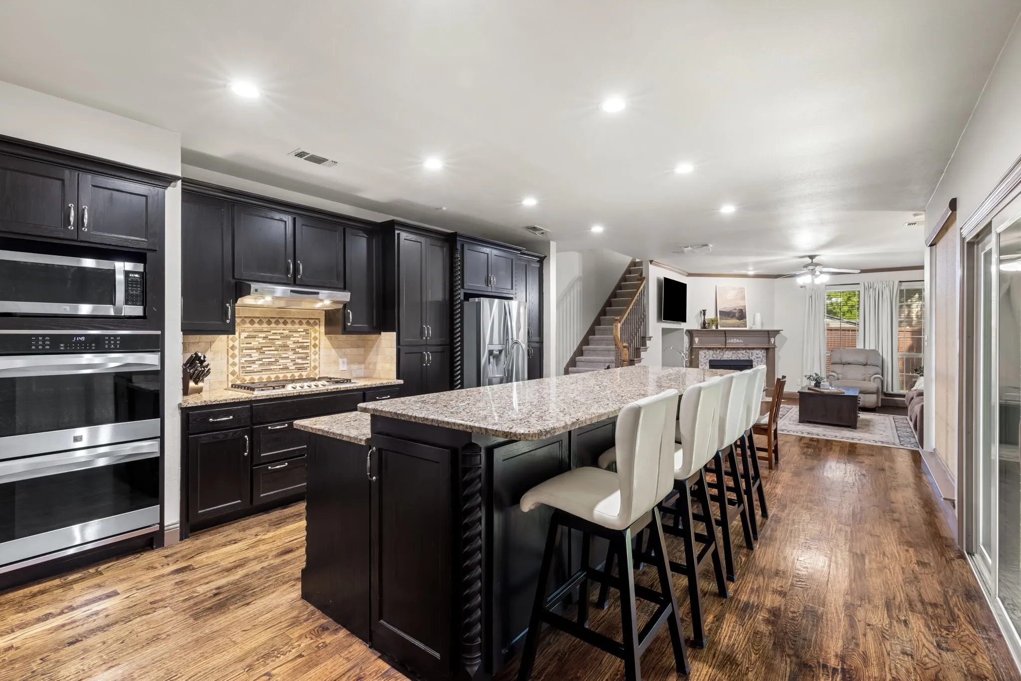 The Kitchen is a WOW!  Double ovens, an abundance of cabinets and countertops, gas cook top and large eat on breakfast bar.