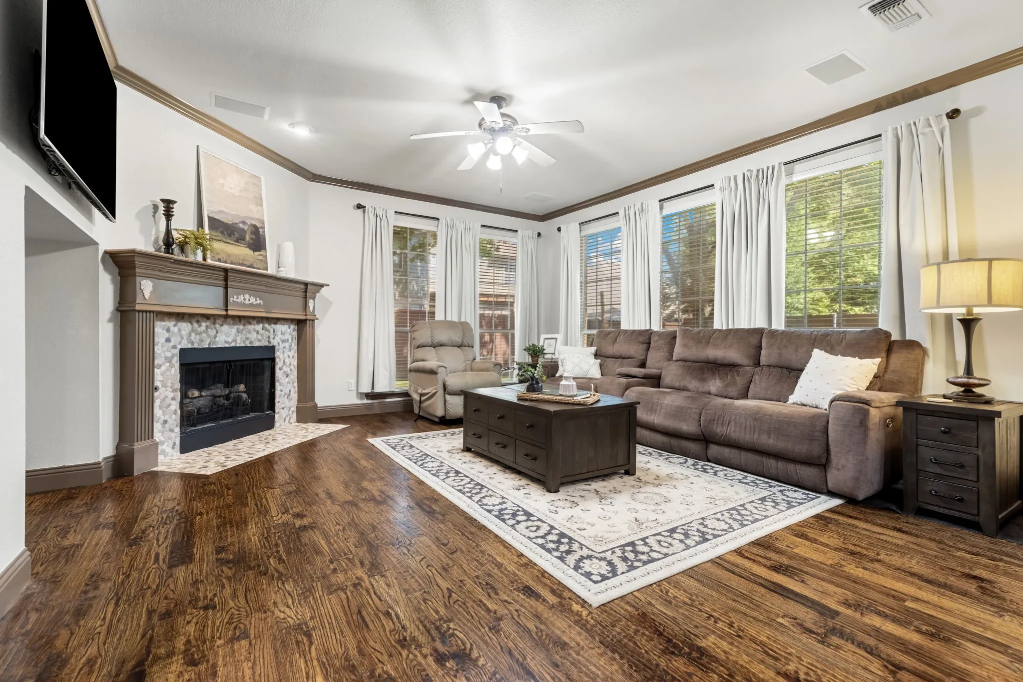 The casual living area overlooks the very spacious and private backyard!  Classic hardwood flooring flows throughout most of the downstairs of this beautiful home.