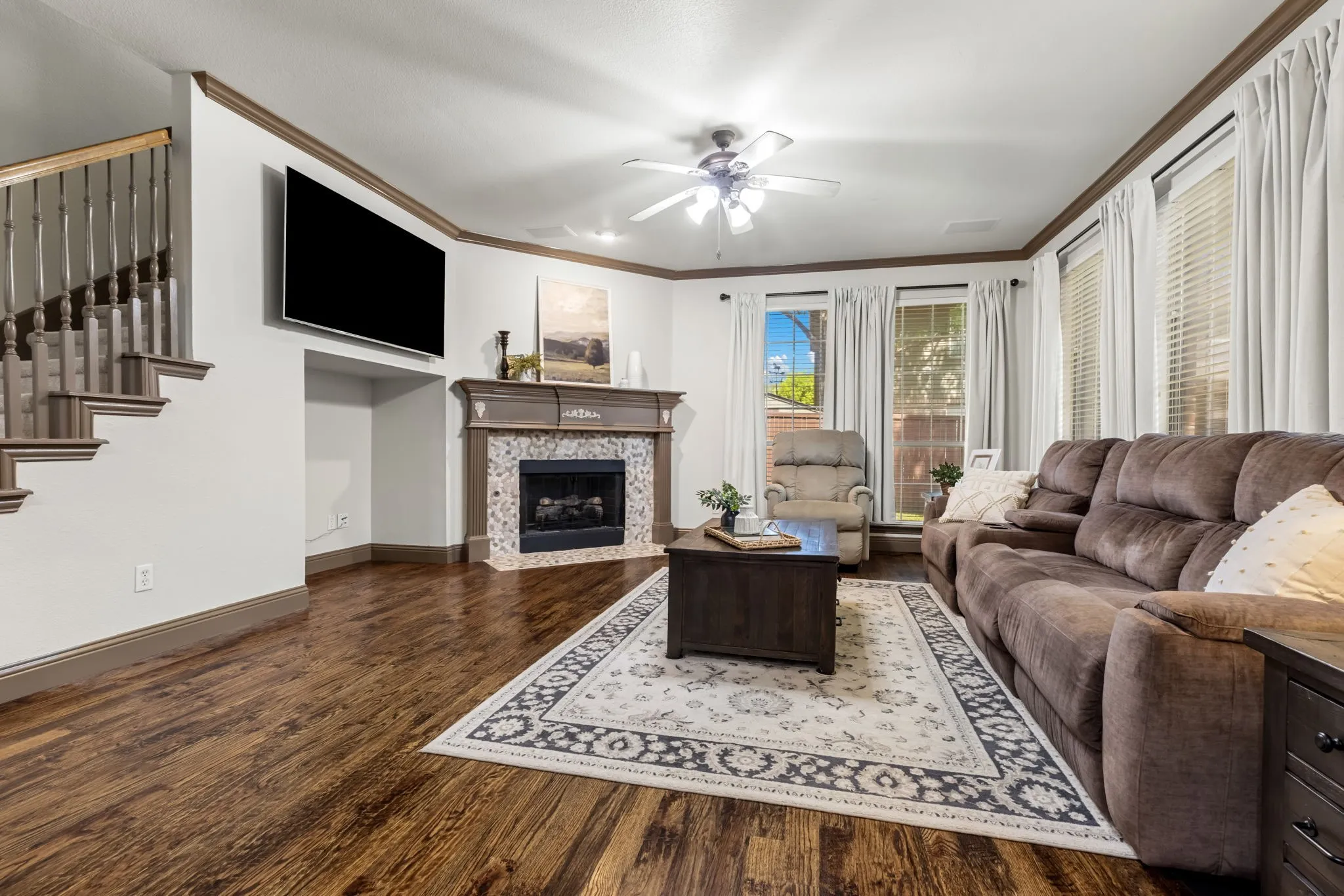 A second staircase leads to a private bedroom suite with full bath and large walk-in closet.