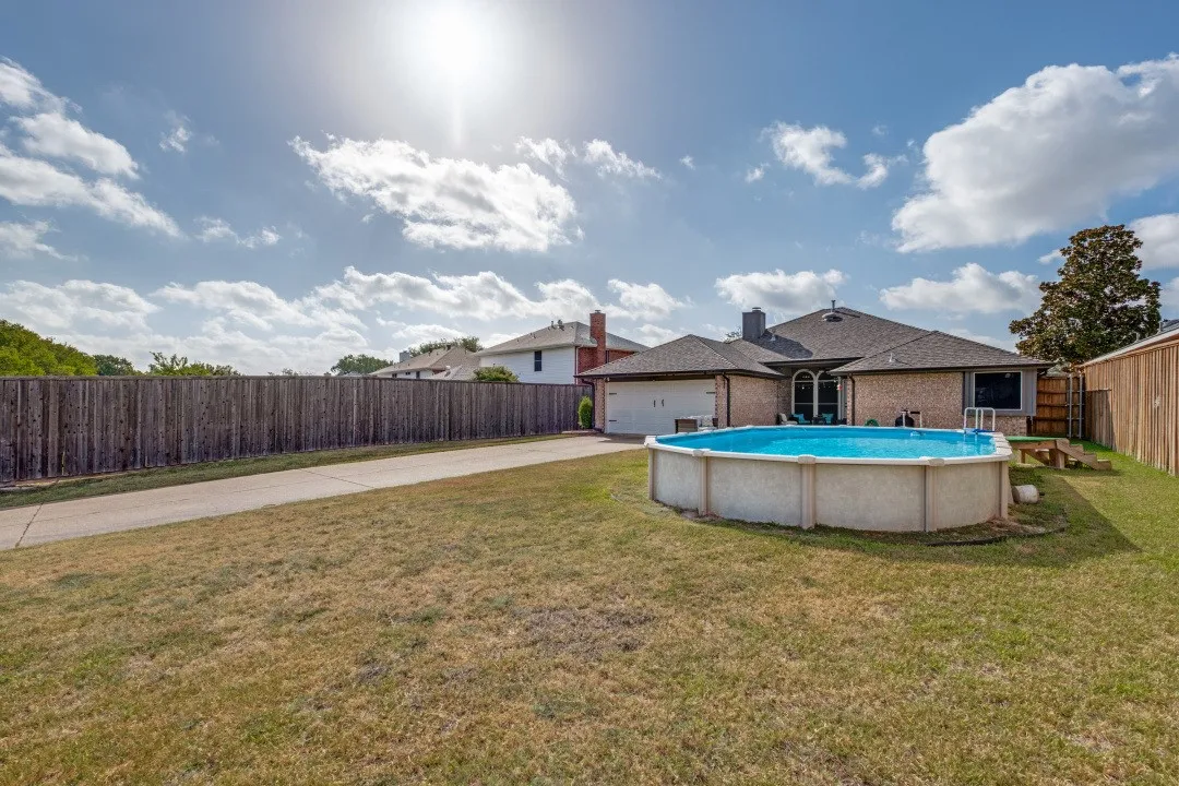.24 acre lot with a very large backyard. Large parking pad for boat, cars, RV, 2-car garage