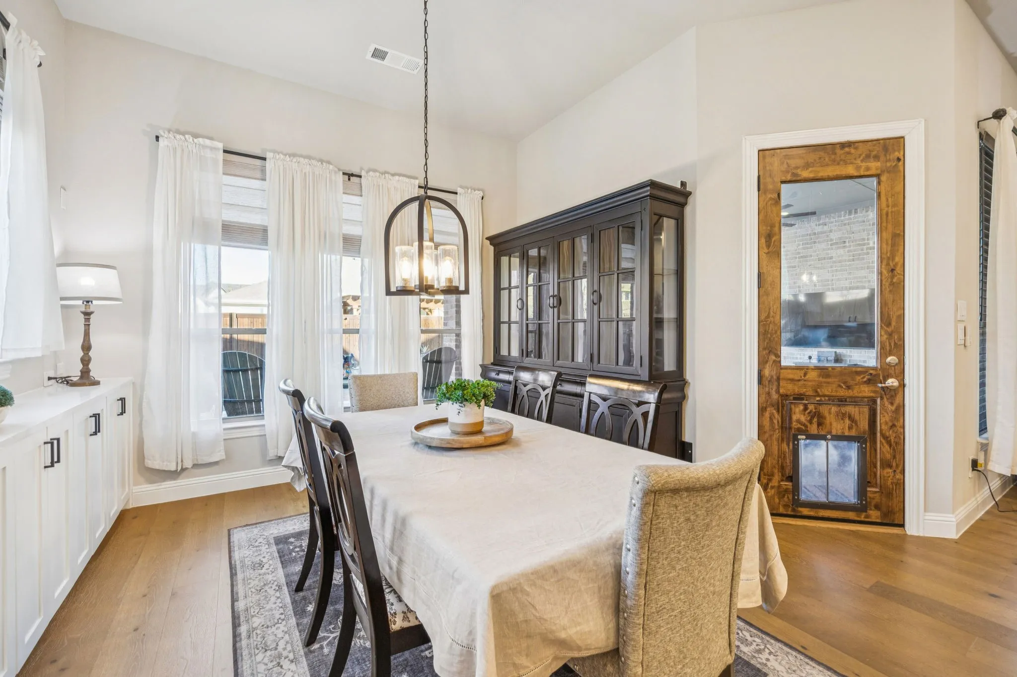 Dining Room Off The Kitchen With Built-In Buffet Cabinets