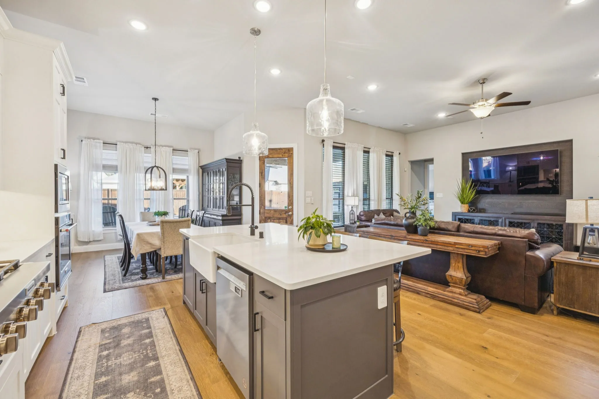 Beautifully Appointed Open-Concept Kitchen With Statement Island Lighting