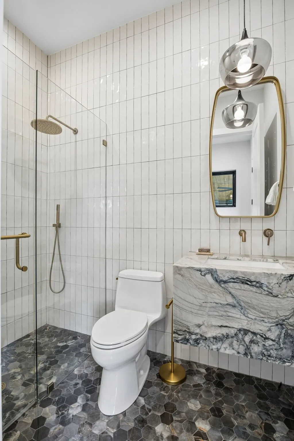Full bath downstairs off kitchen and bar. Great for outdoor use.