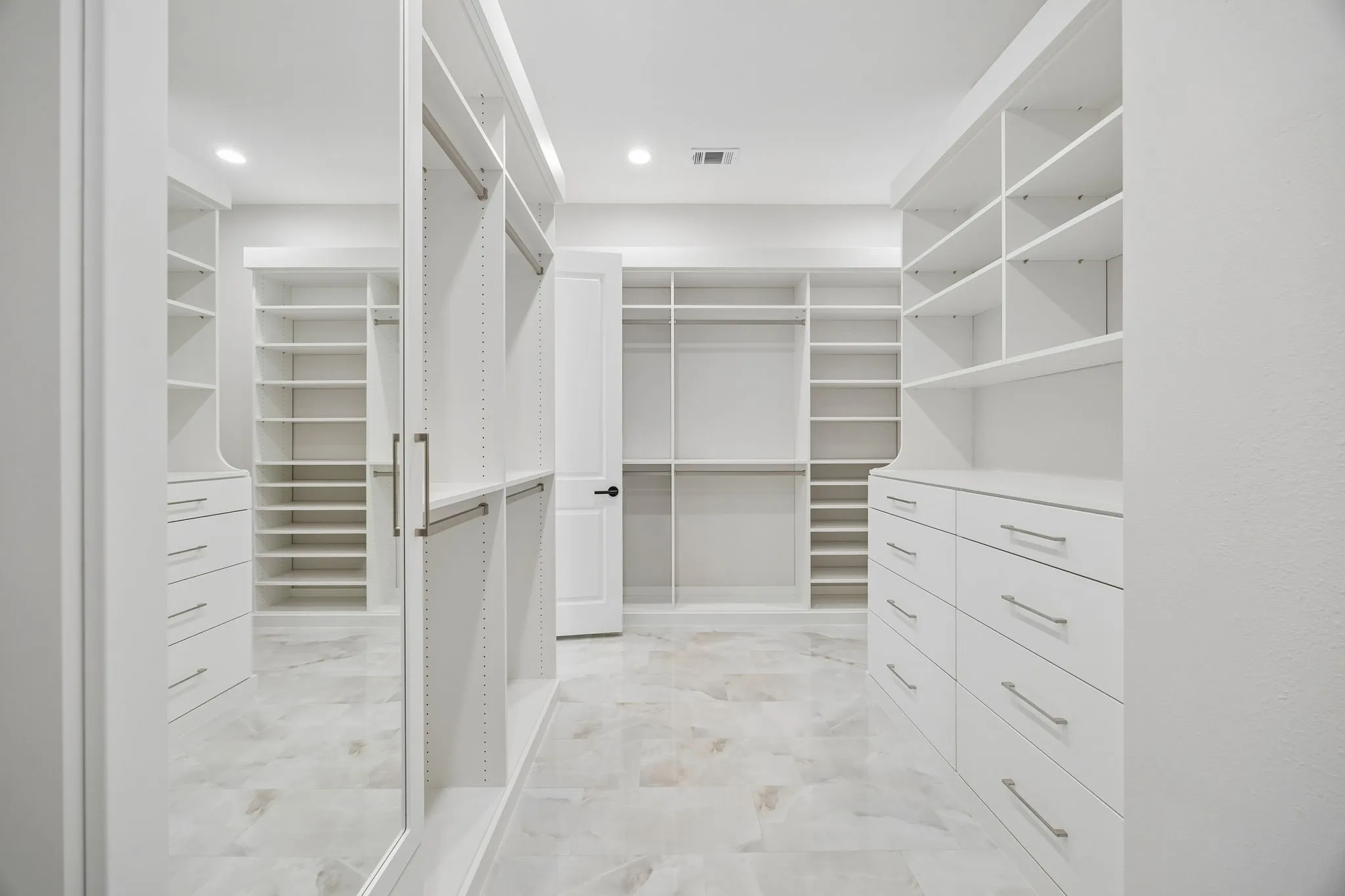 Primary closet also has a laundry area for owner convenience