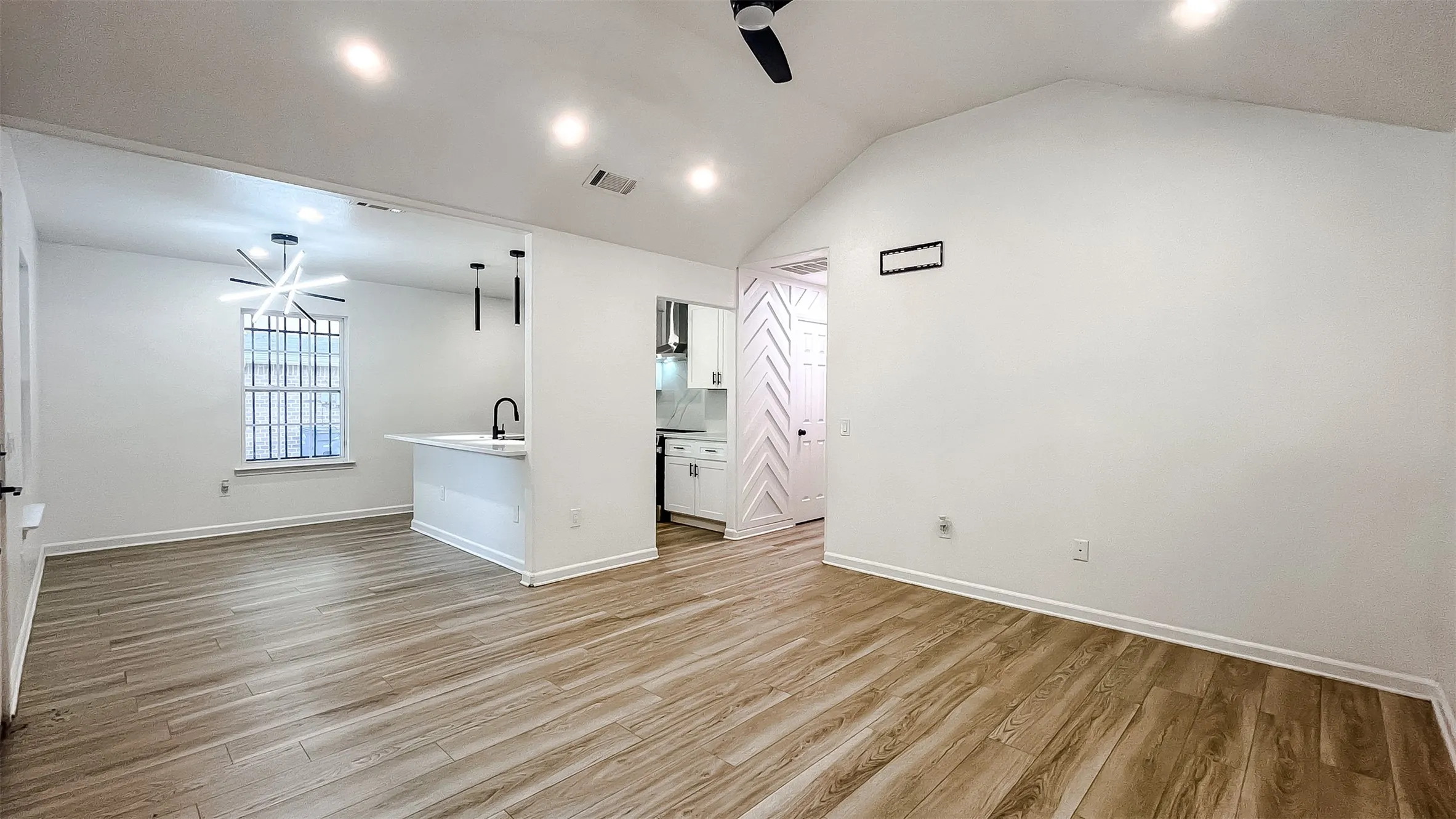 Seamless flow between rooms with low-maintenance flooring and fresh paint throughout.