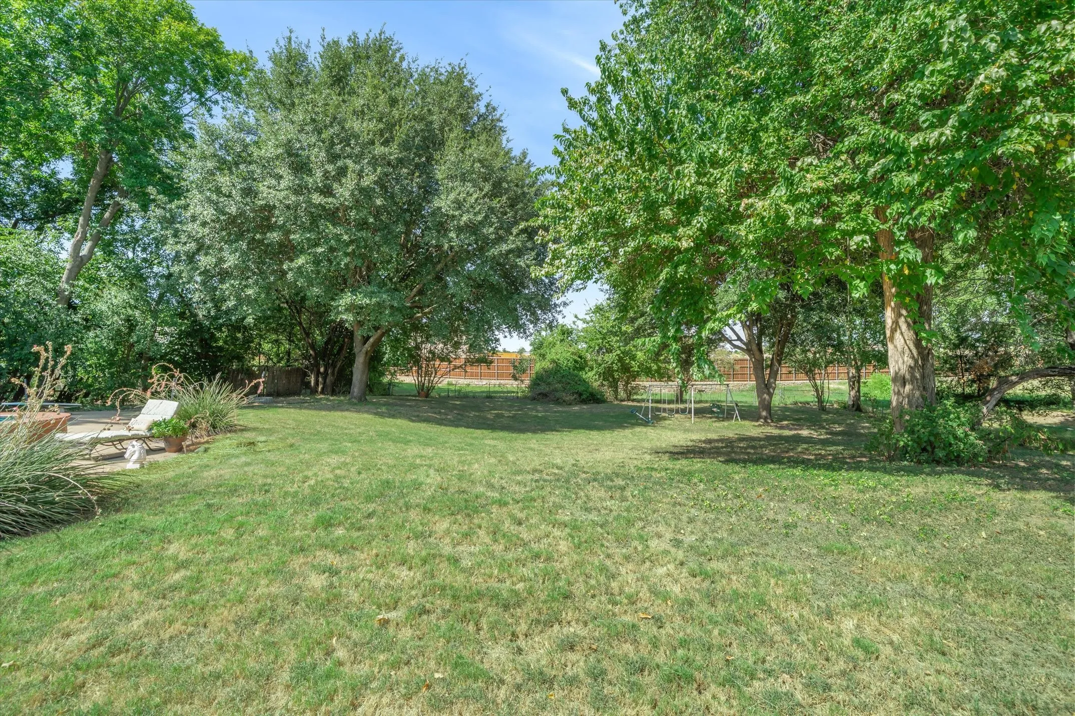 Immediate backyard area next to the pool -- plenty of space for all your gardening and/or play activities