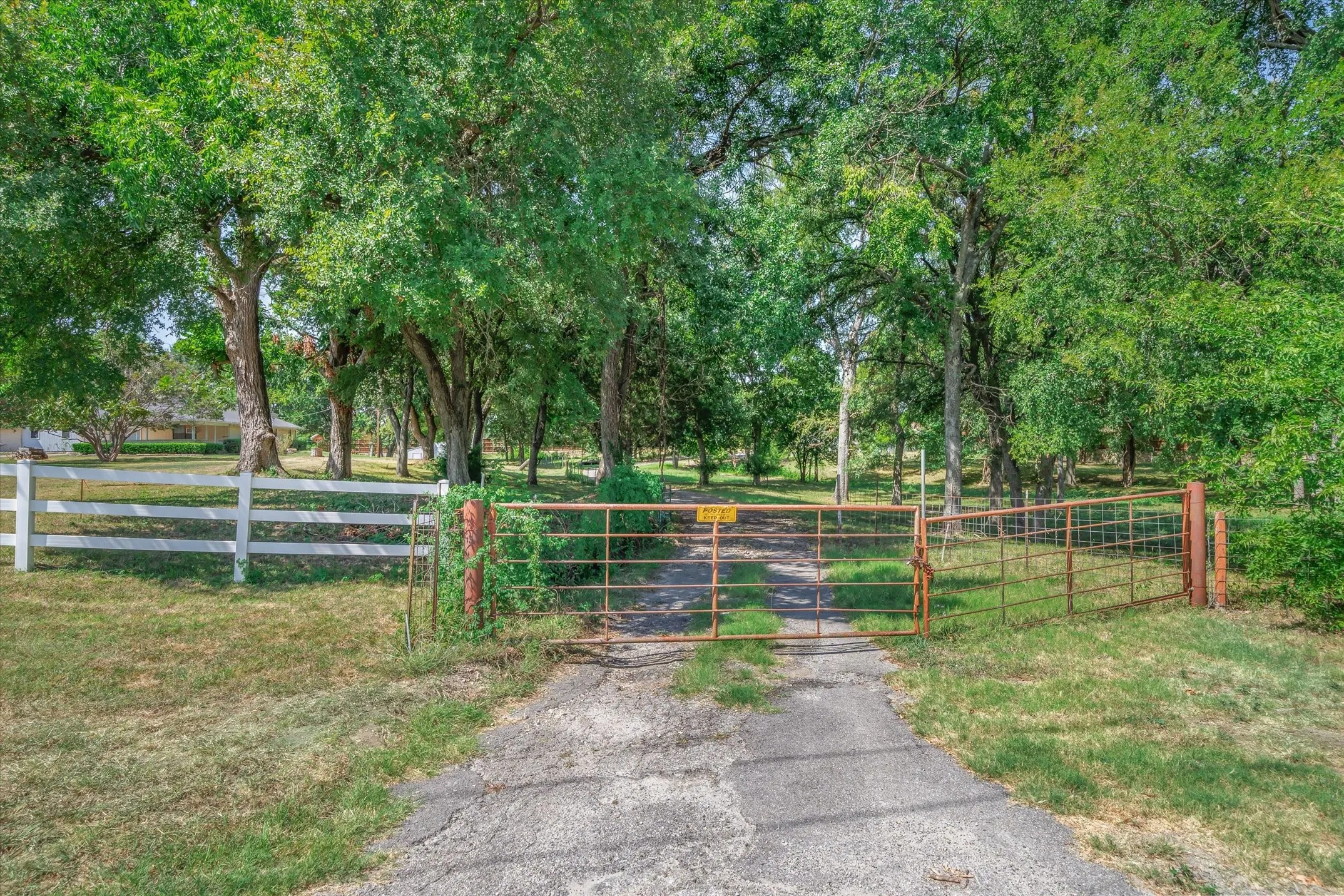 The second gate with driveway leading up to the 60 X 60 shop/barn combination