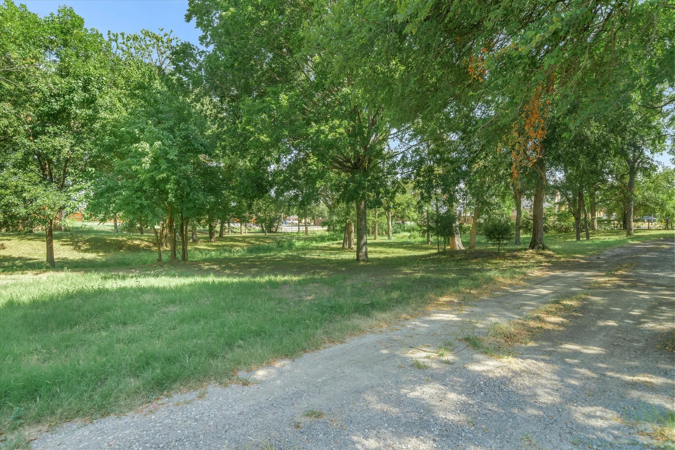 Beautiful acreage -- a park-like setting shaded by a canopy of established oaks and other hardwoods.
