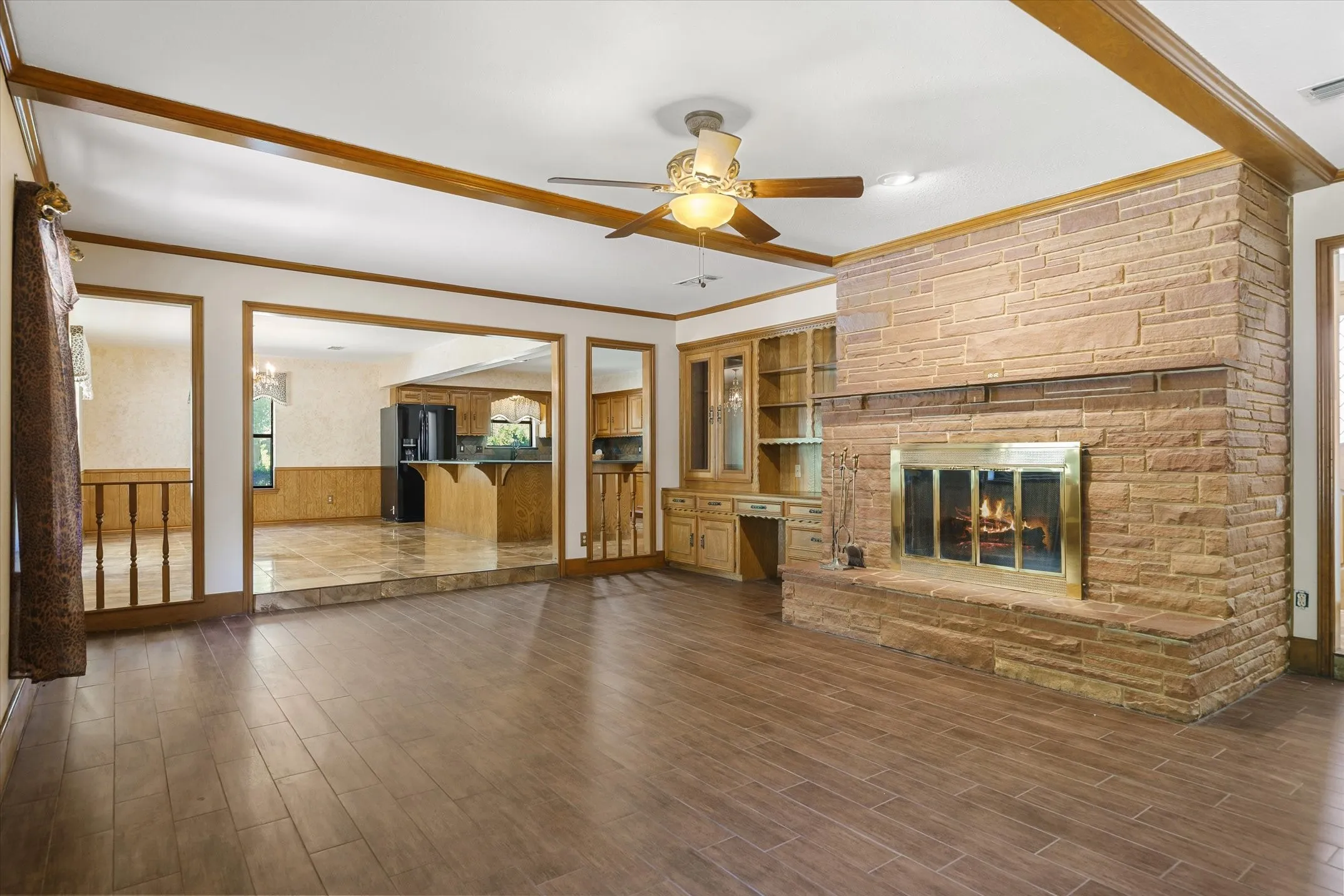Beautiful stacked stone fireplace and hearth and built-in desk, bookshelves, and gun case with a working, all-house intercom/radio system.