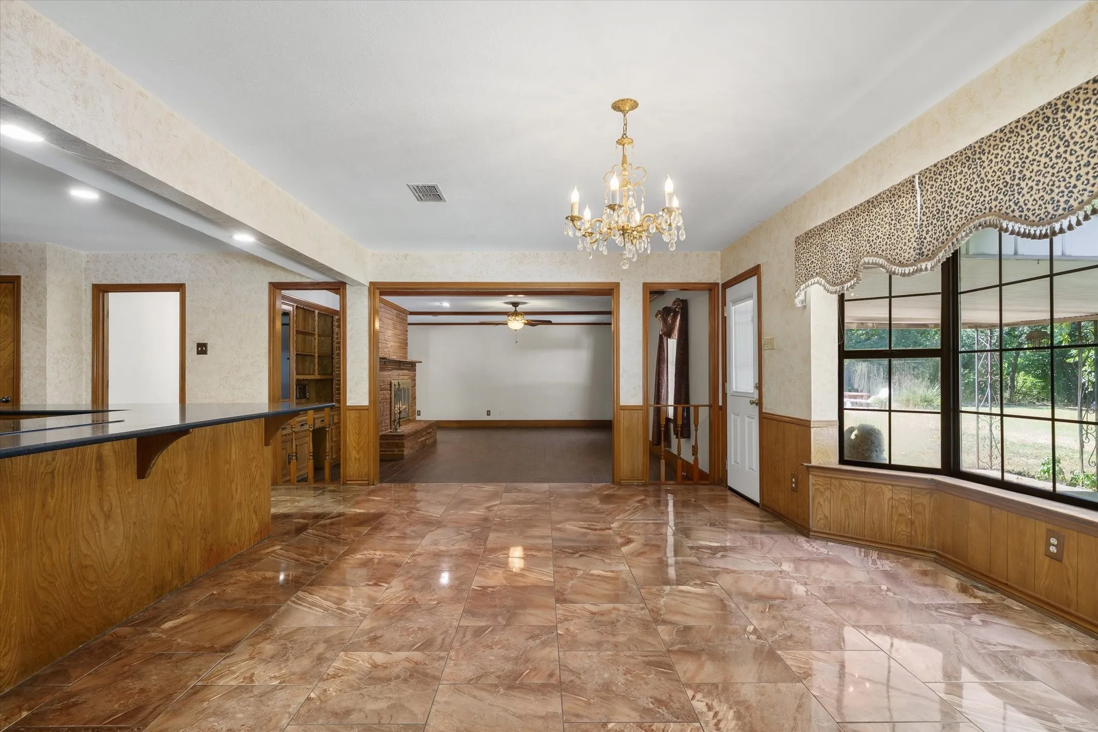 Large dining area and seating at the island -- plenty of space for even the largest gatherings. Dining area opens into the large living room.