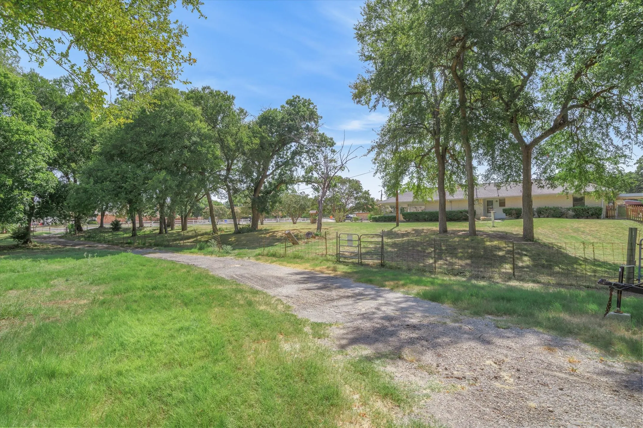 View of the acreage and shop area looking up the hill to the side of the house