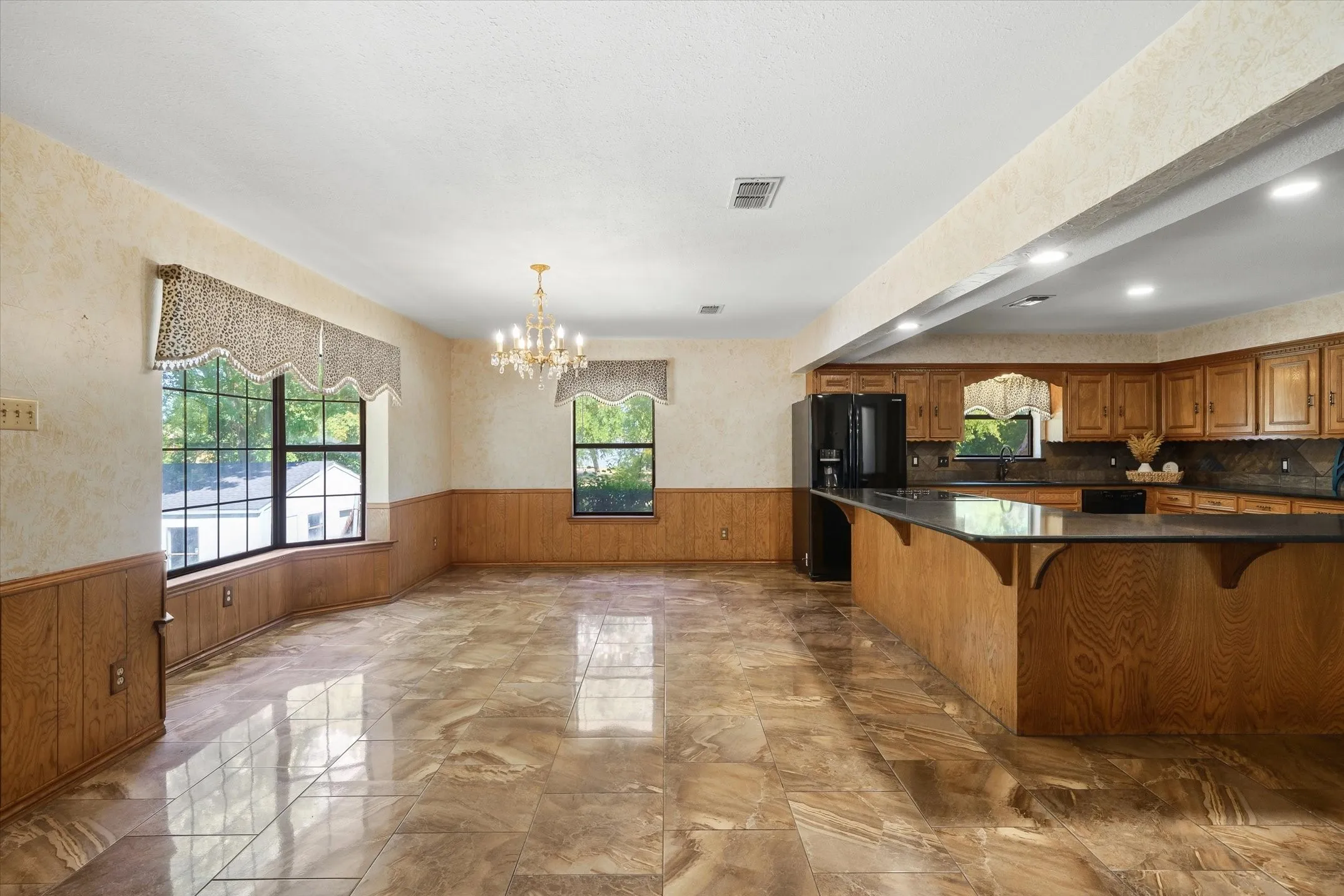 View of dining area and kitchen coming in from the living room