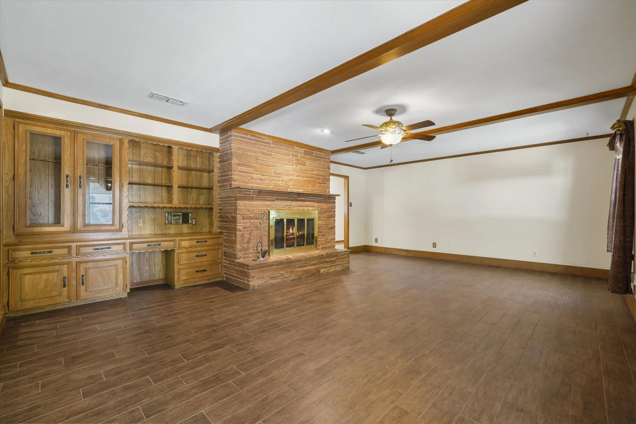 Beautiful stacked stone fireplace and hearth and built-in desk, bookshelves, and gun case with a working, all-house intercom/radio system.