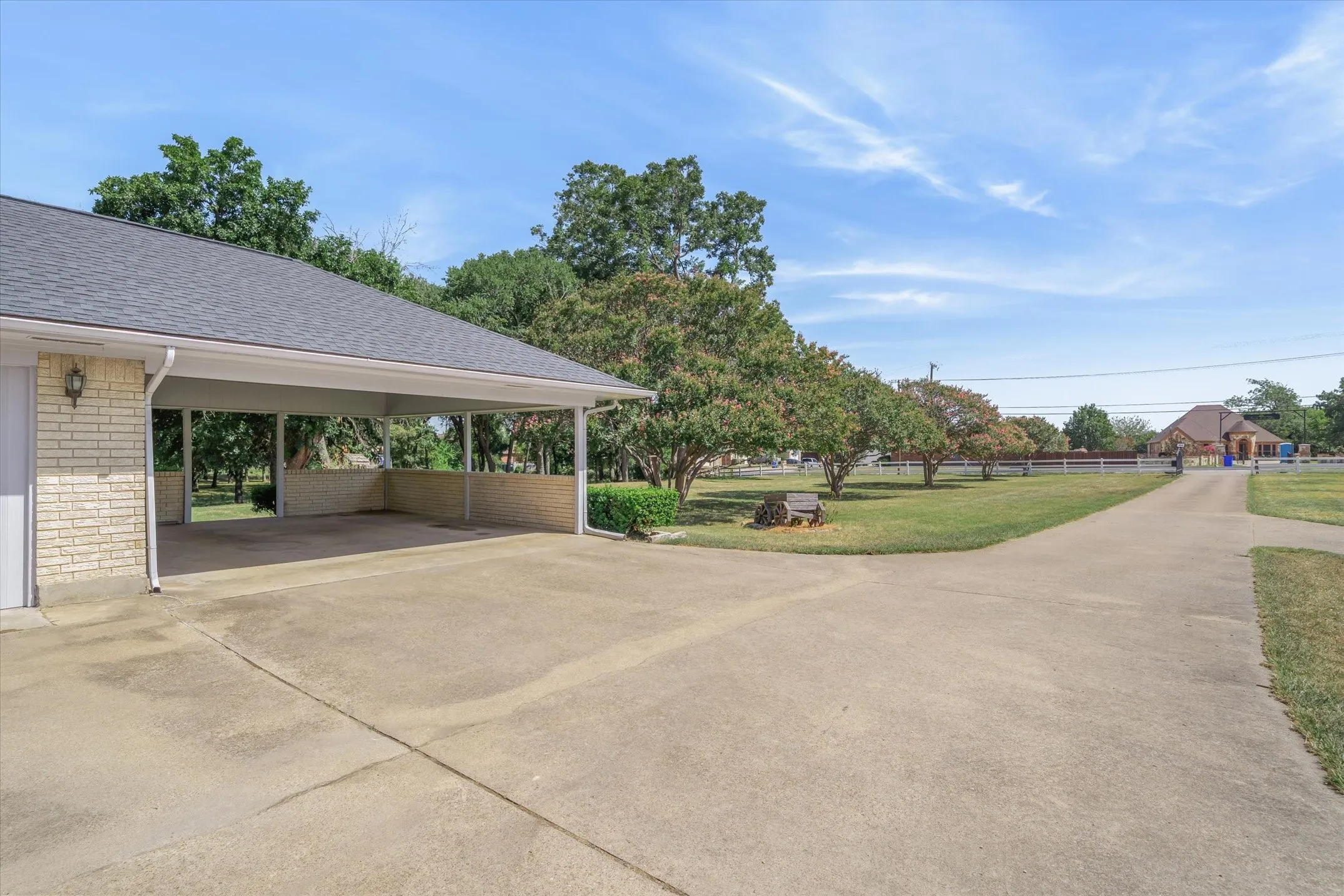 An attached carport and a circle drive